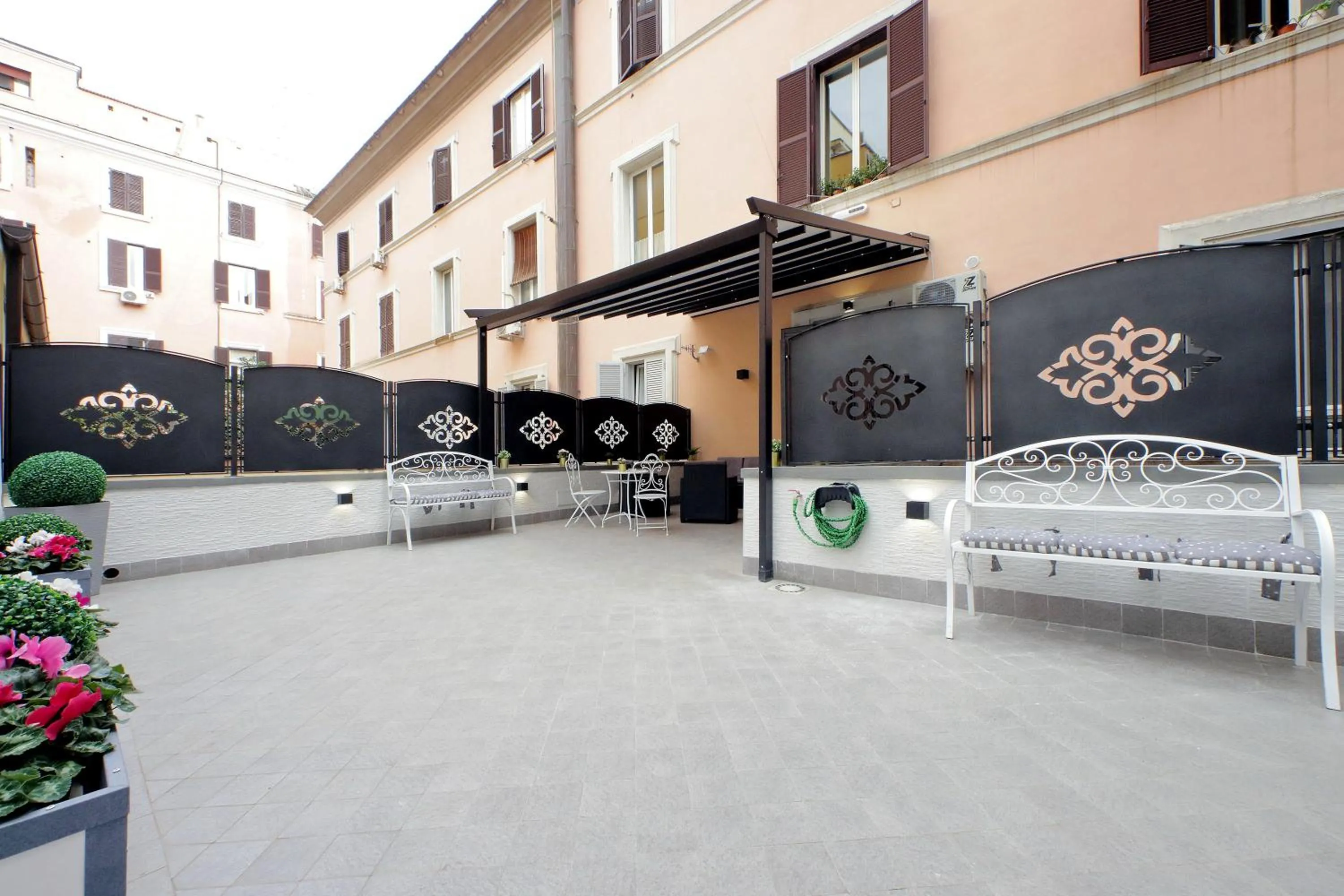 Patio in Roman Holiday Suites