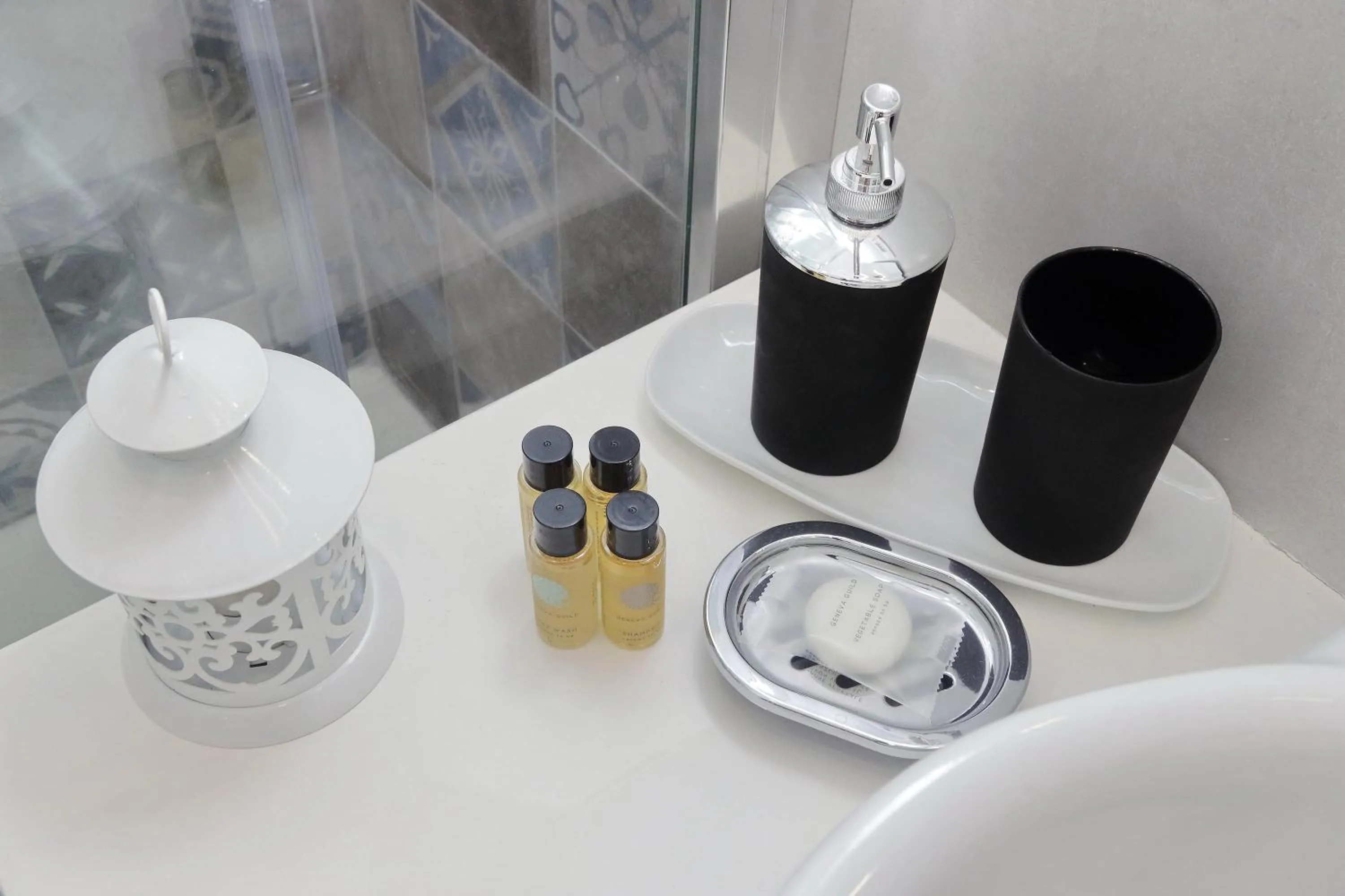 Toilet in Roman Holiday Suites