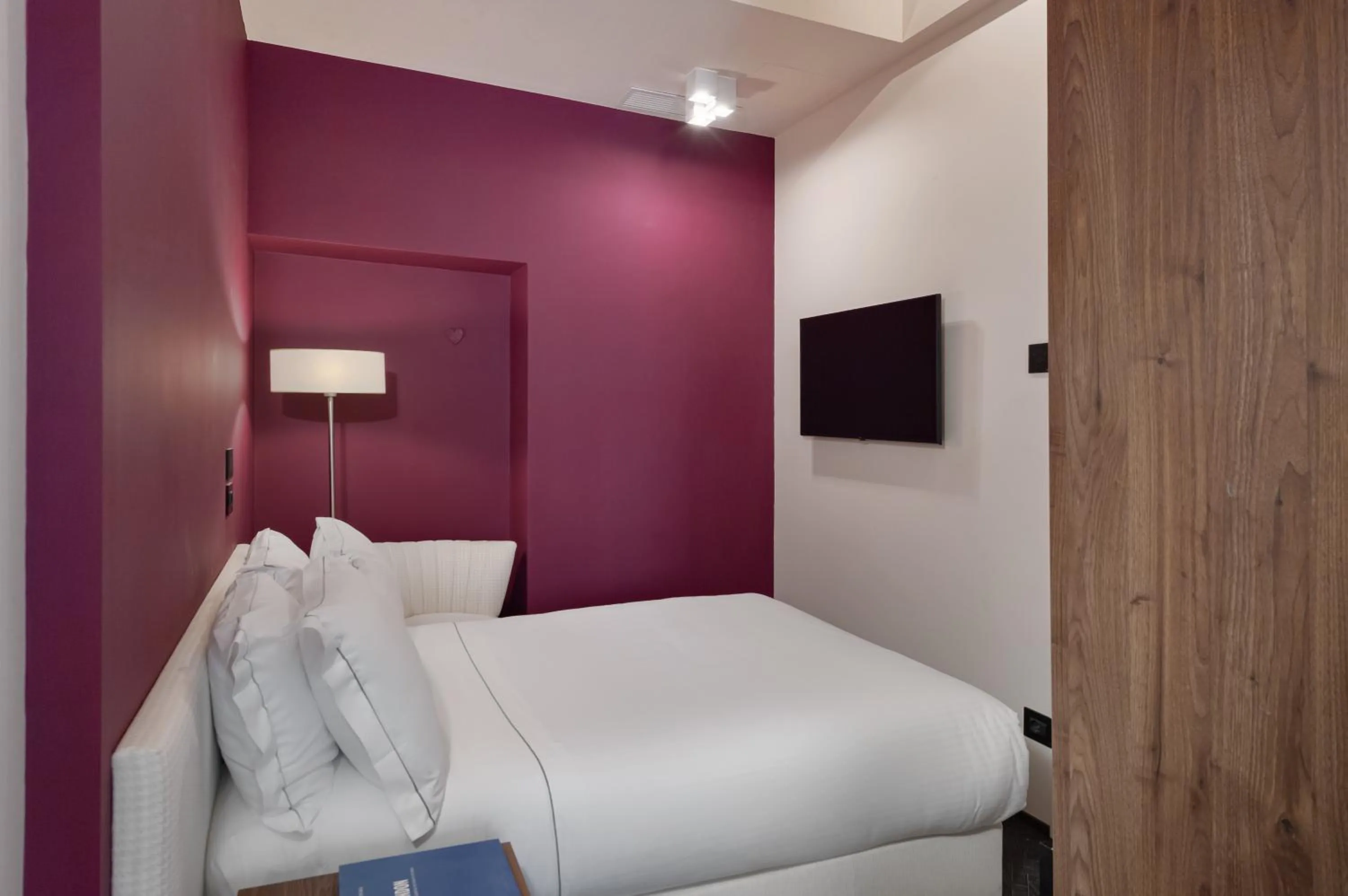 Bed in Passpartout Boutique Palace