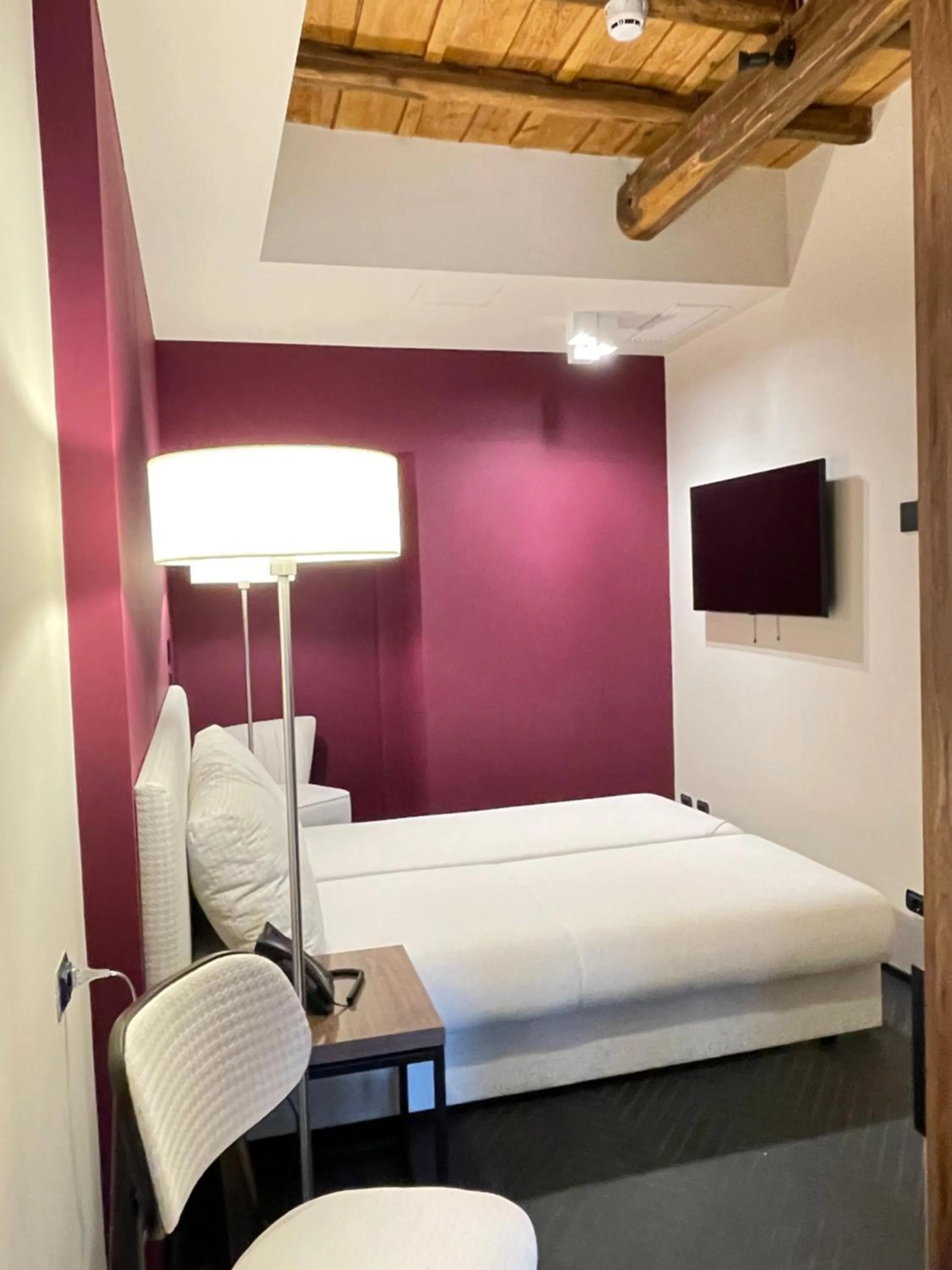 Bed in Passpartout Boutique Palace