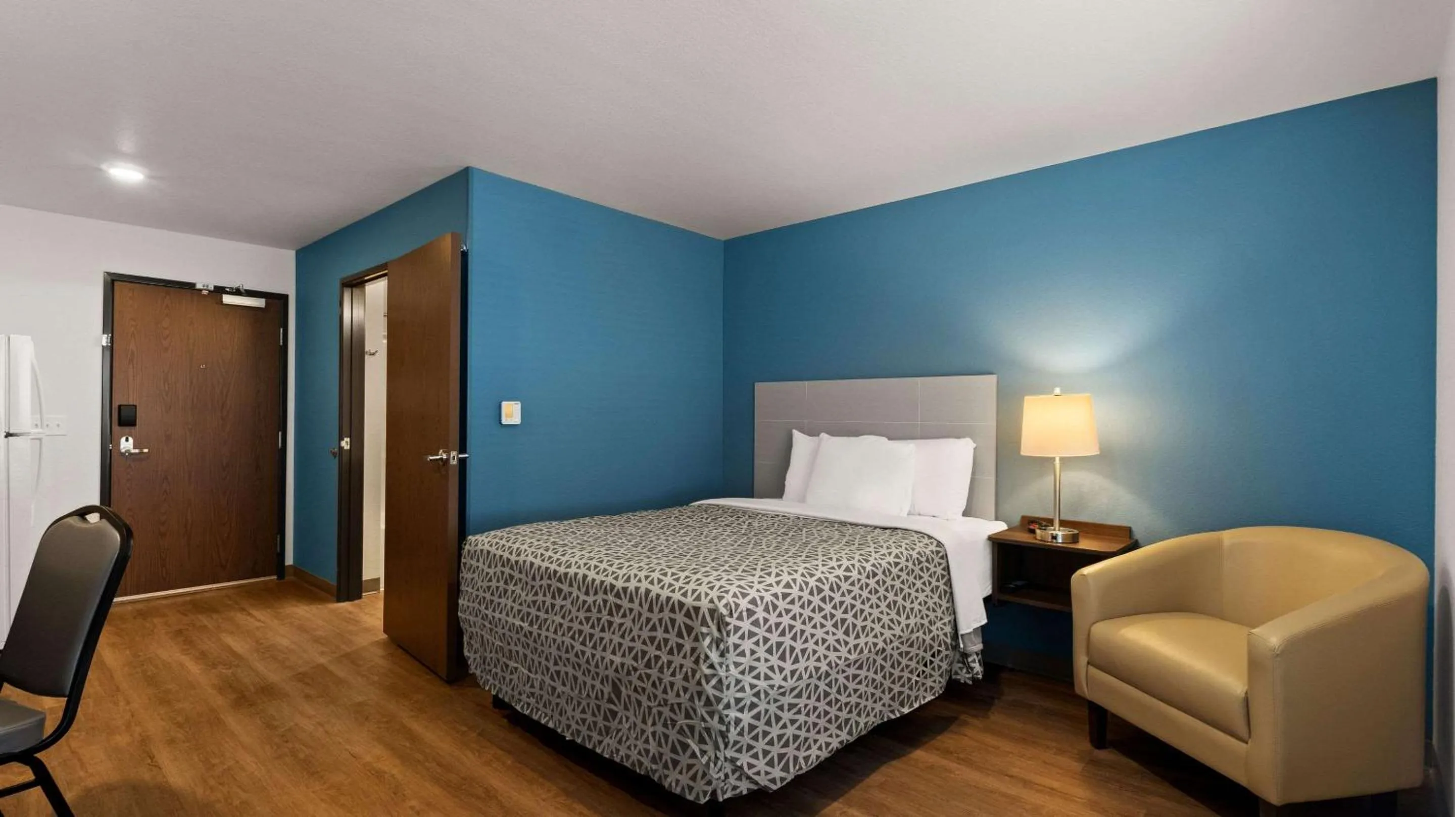 Bedroom in WoodSpring Suites Greeley