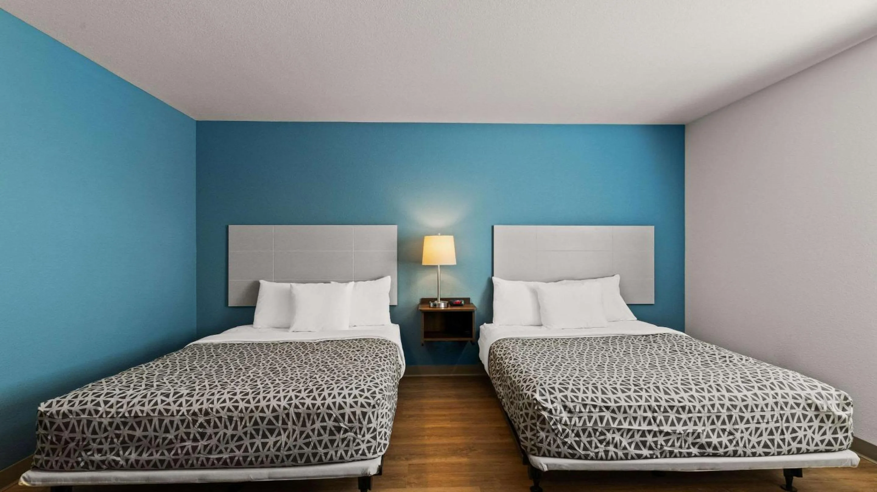 Bedroom in WoodSpring Suites Greeley