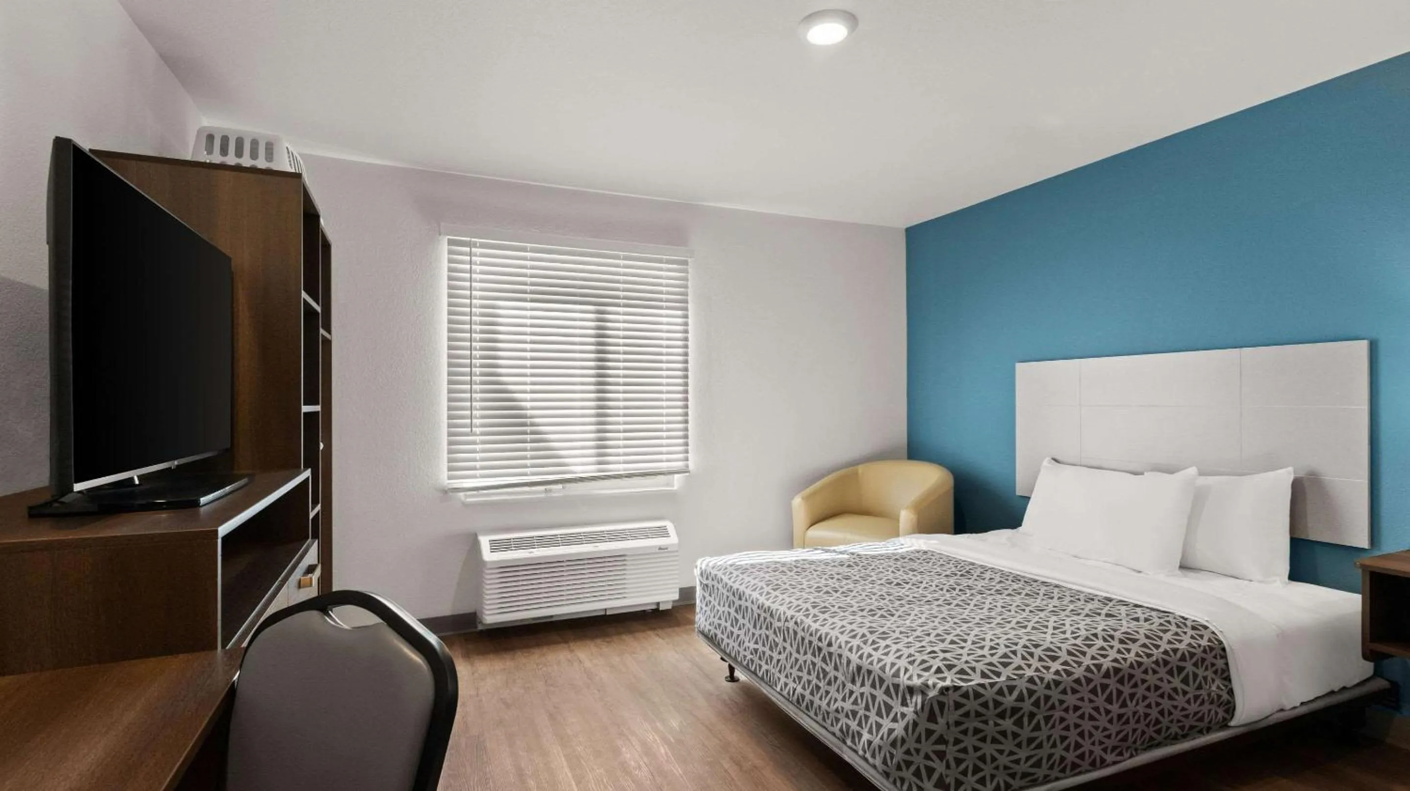 Bedroom in WoodSpring Suites Greeley