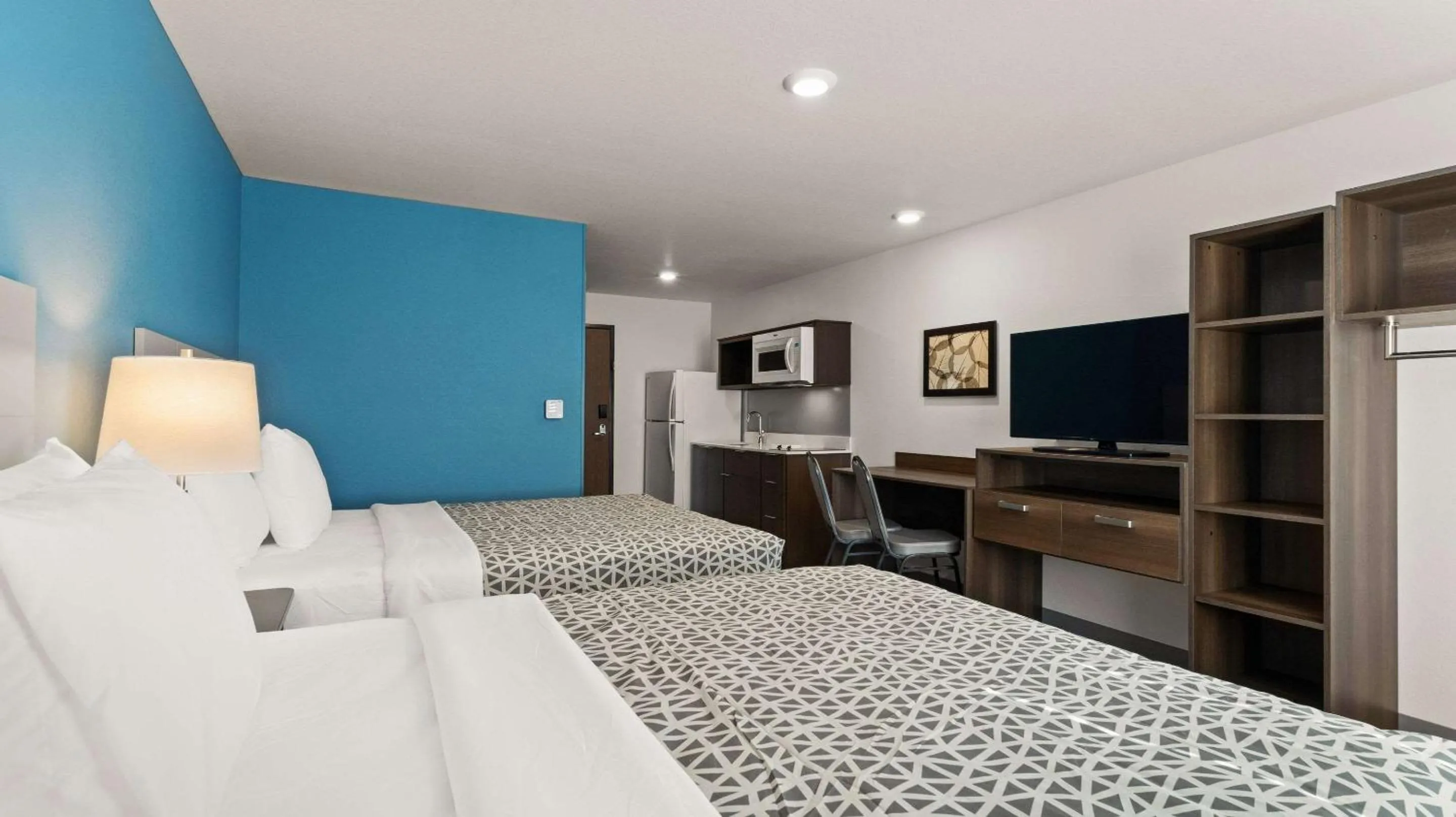 Bedroom in WoodSpring Suites Greeley