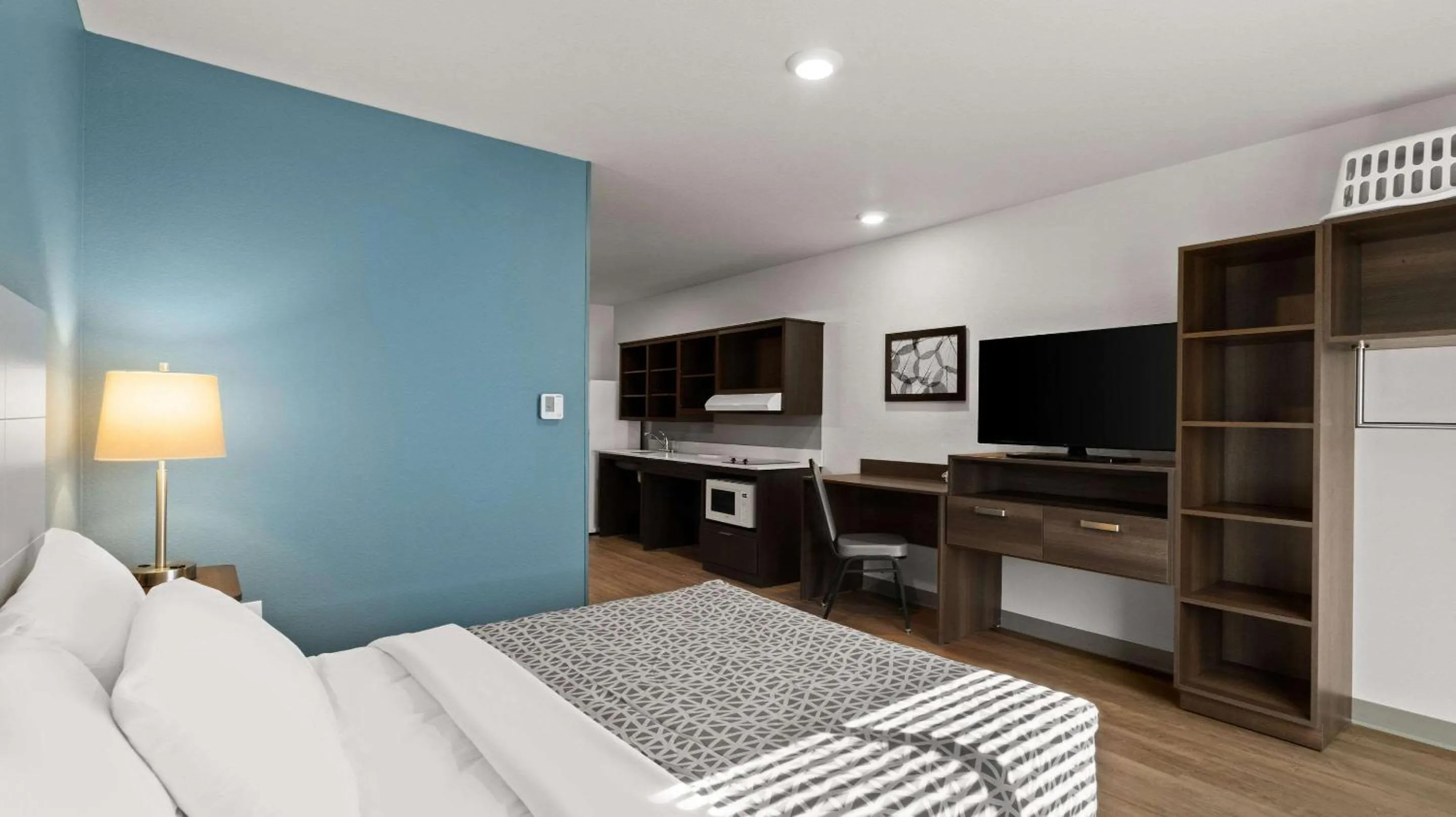 Bedroom in WoodSpring Suites Greeley