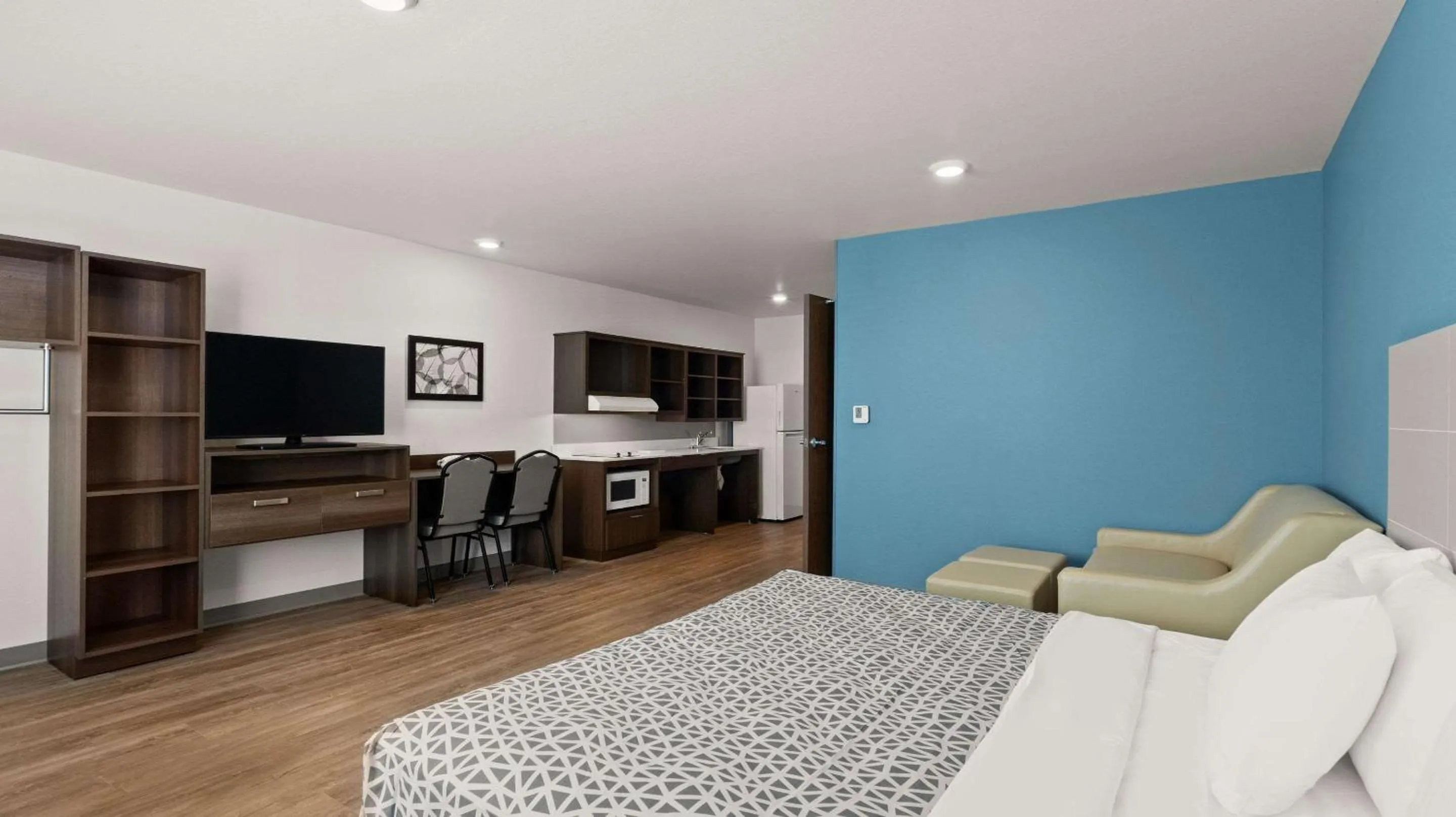 Bedroom in WoodSpring Suites Greeley