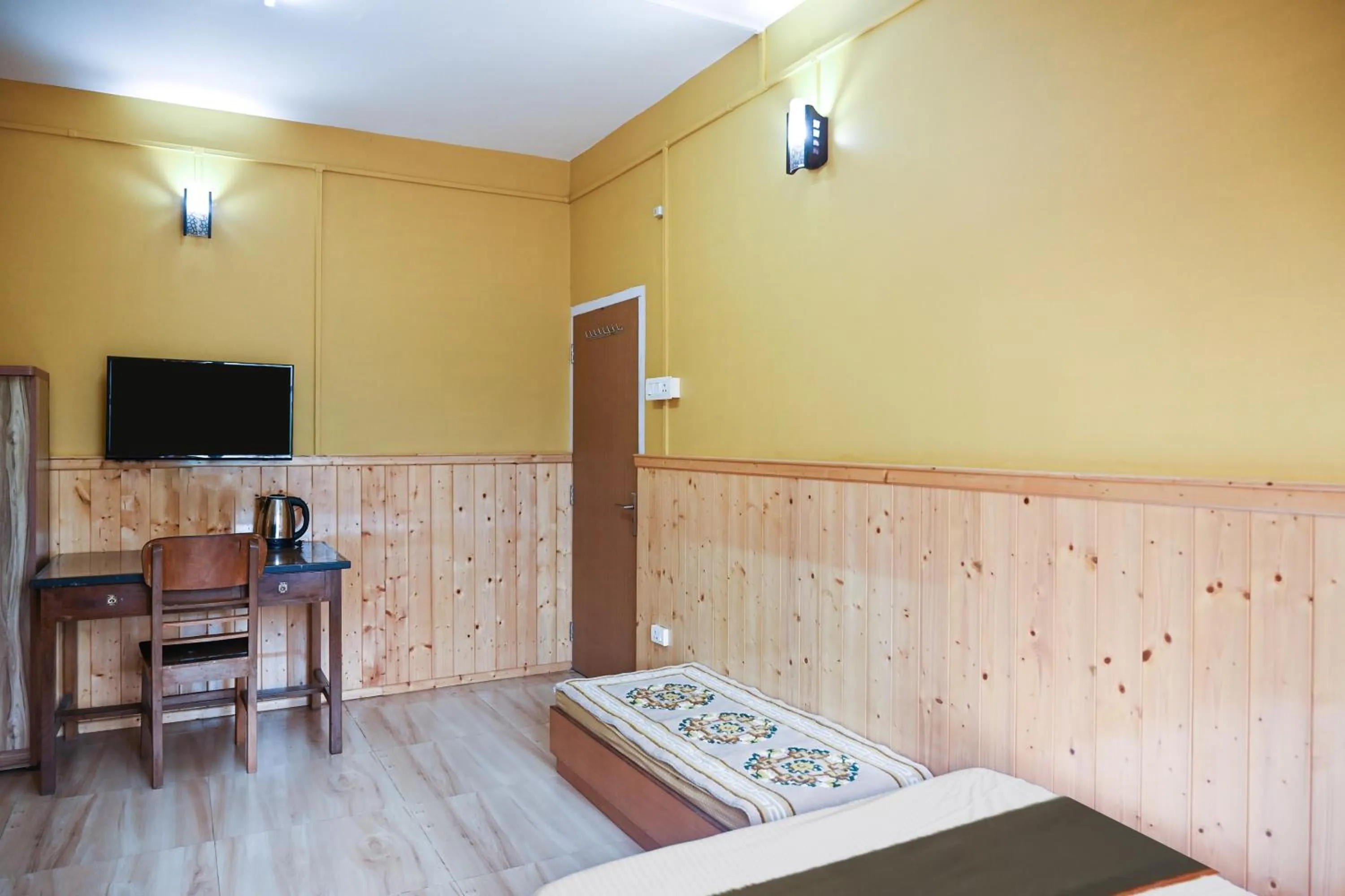 Bedroom in Hotel O Kaizen Residency