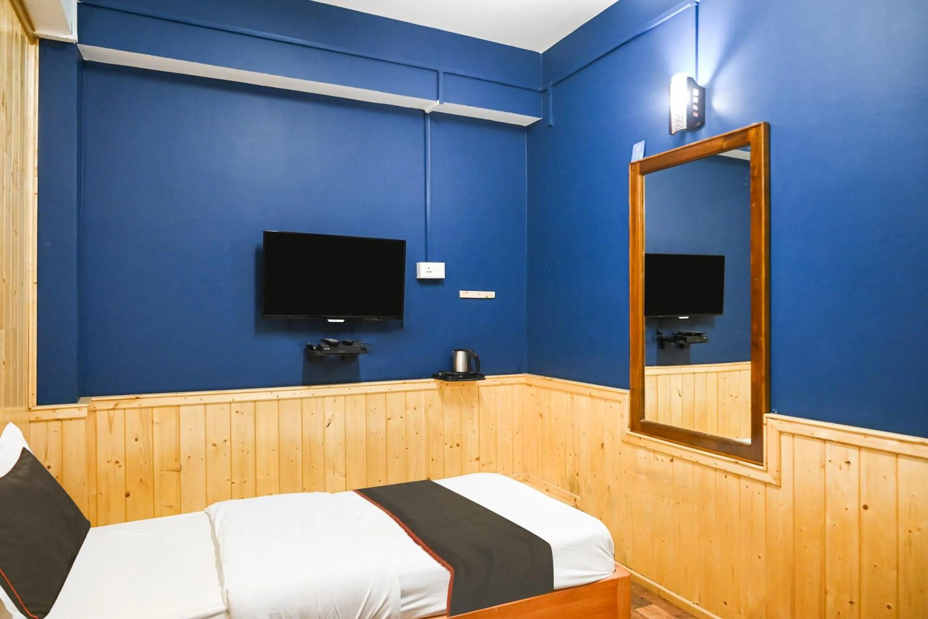 Bedroom in Hotel O Kaizen Residency