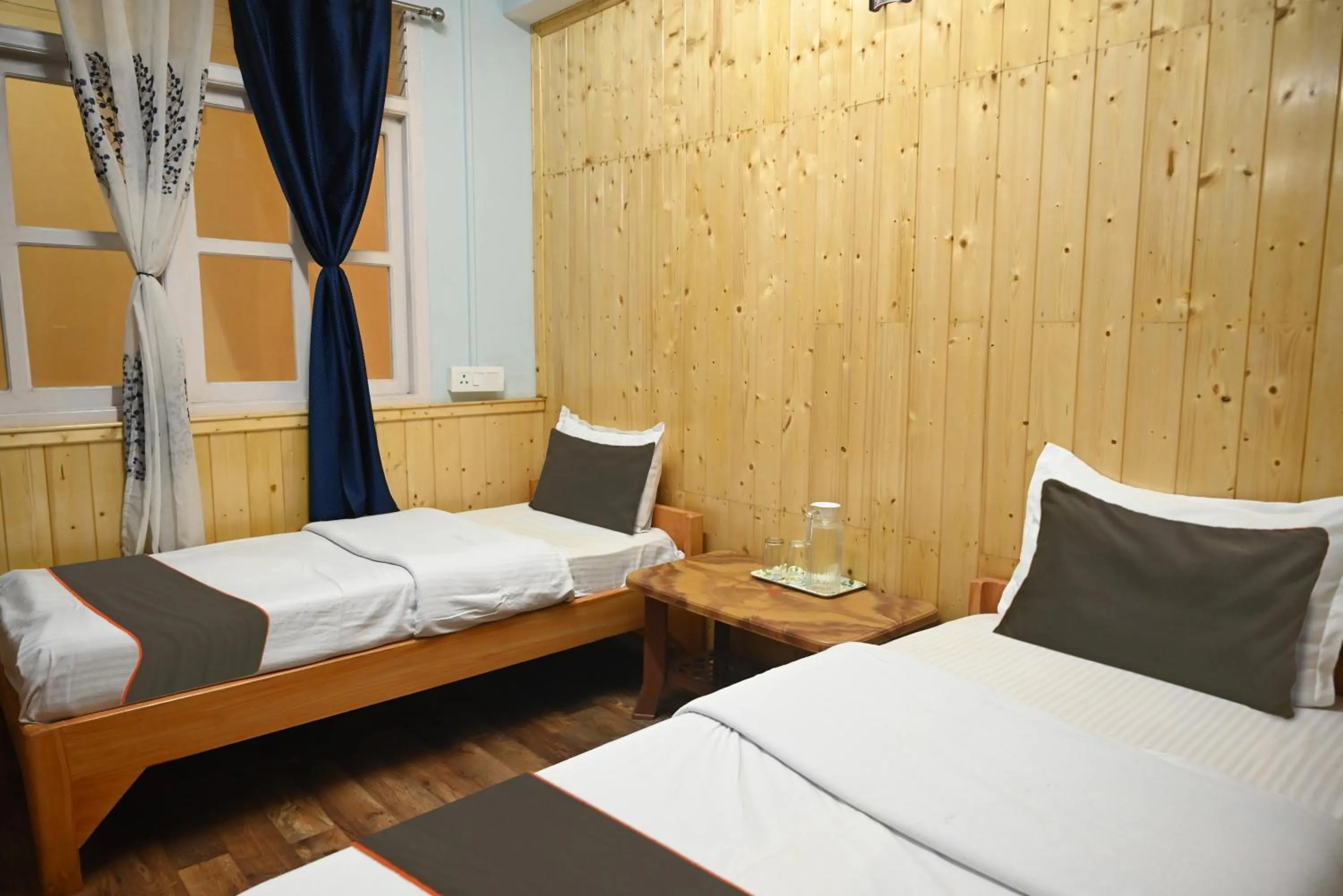 Bedroom in Hotel O Kaizen Residency