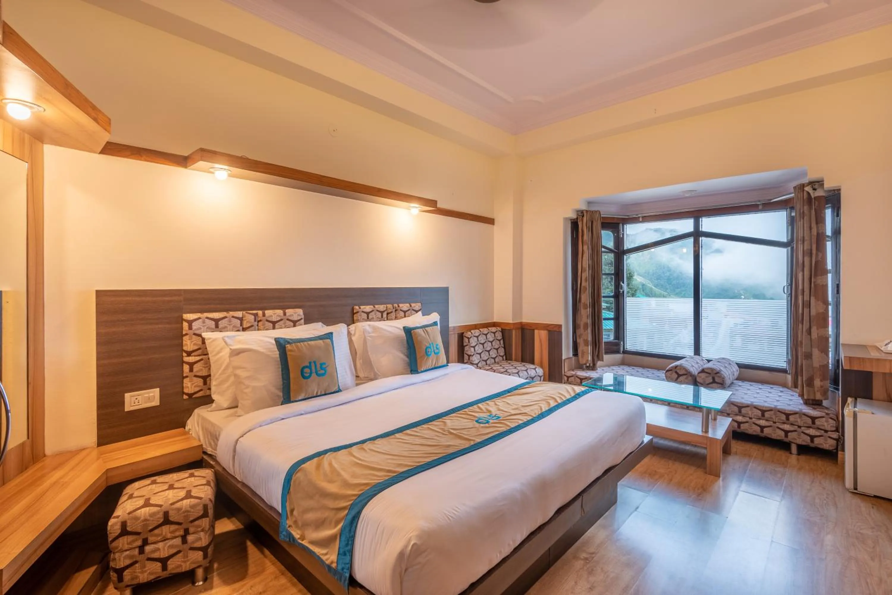 Bed in Meghavan Resort By DLS Hotels