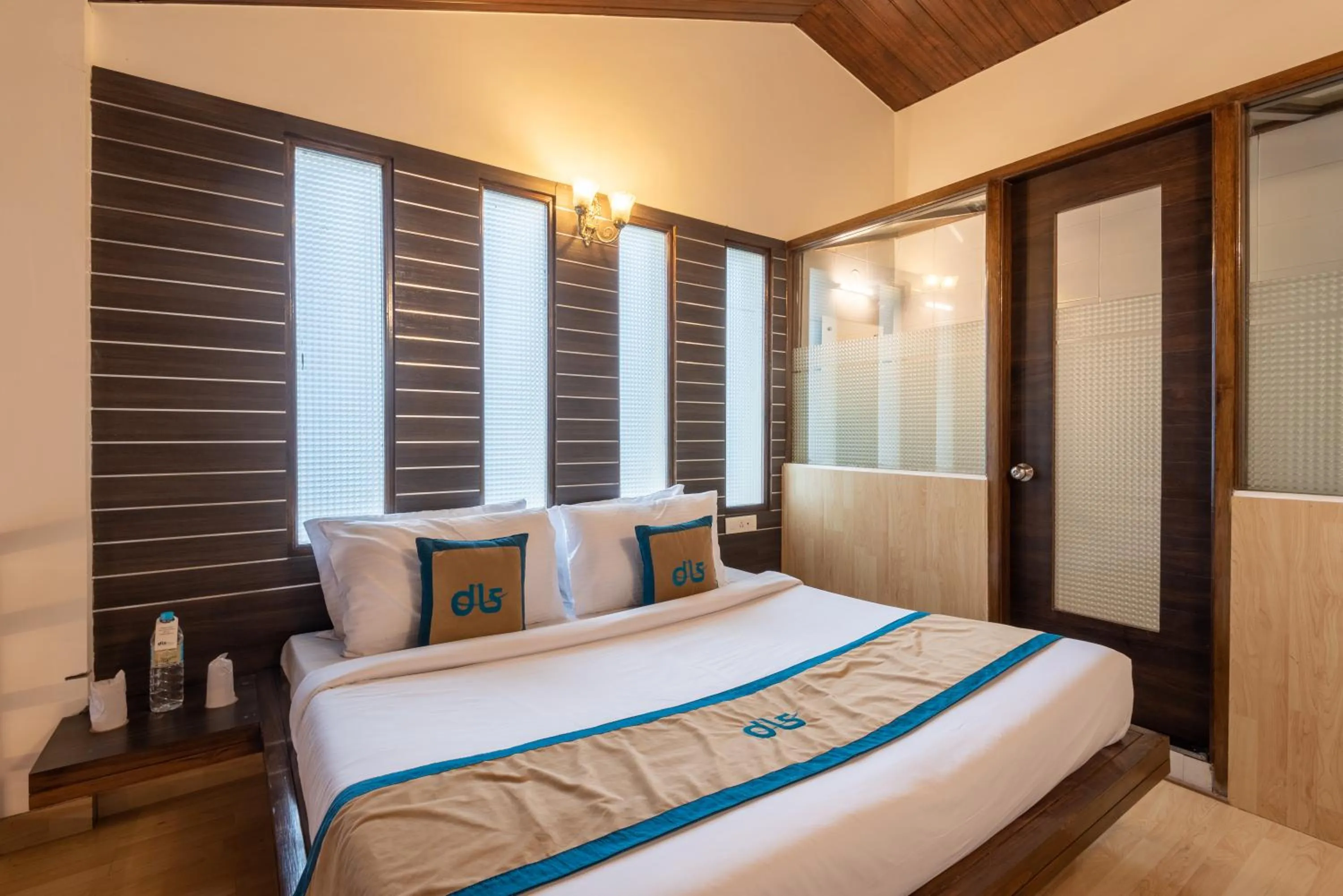 Bed in Meghavan Resort By DLS Hotels