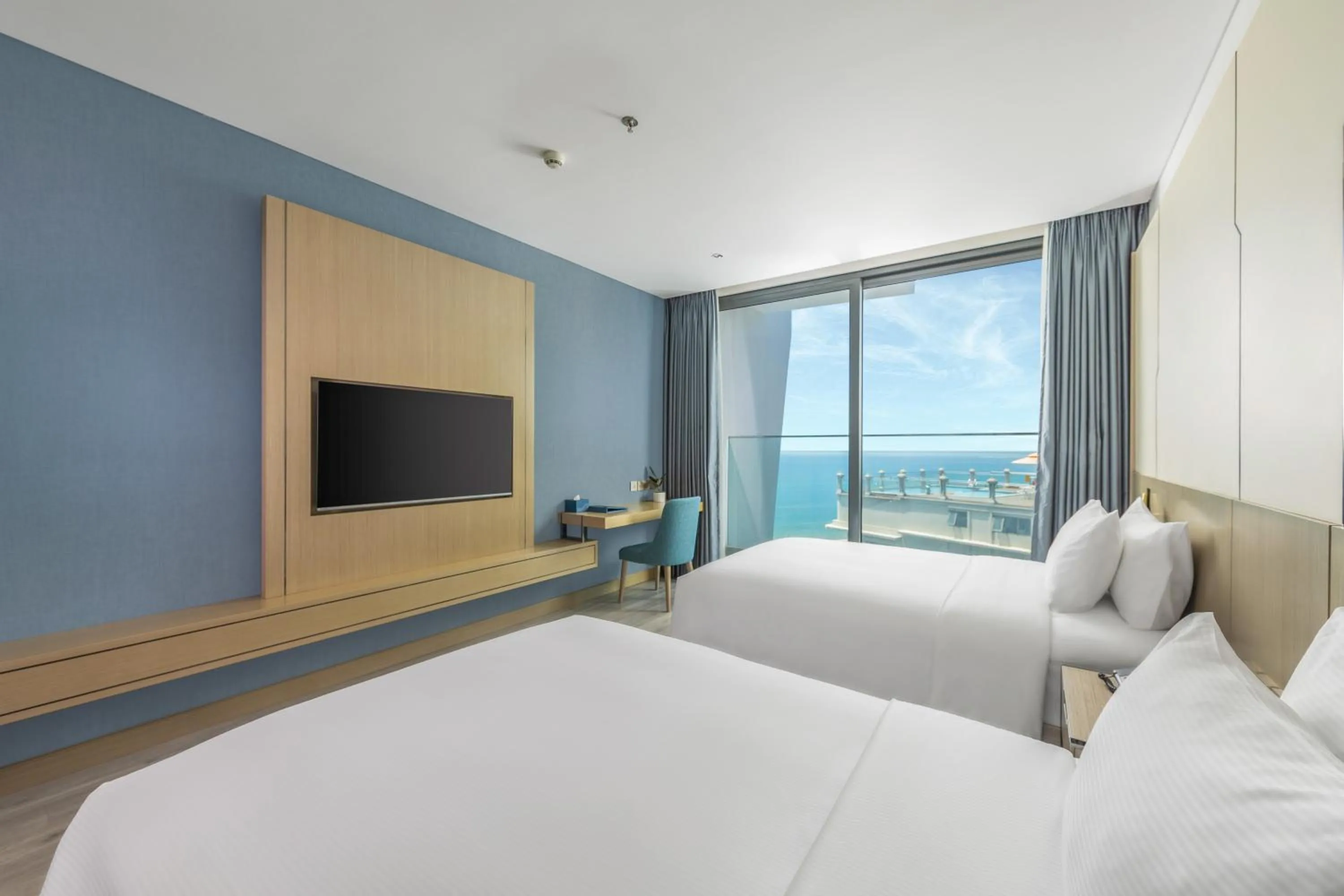 Bed in Awaken Da Nang Hotel