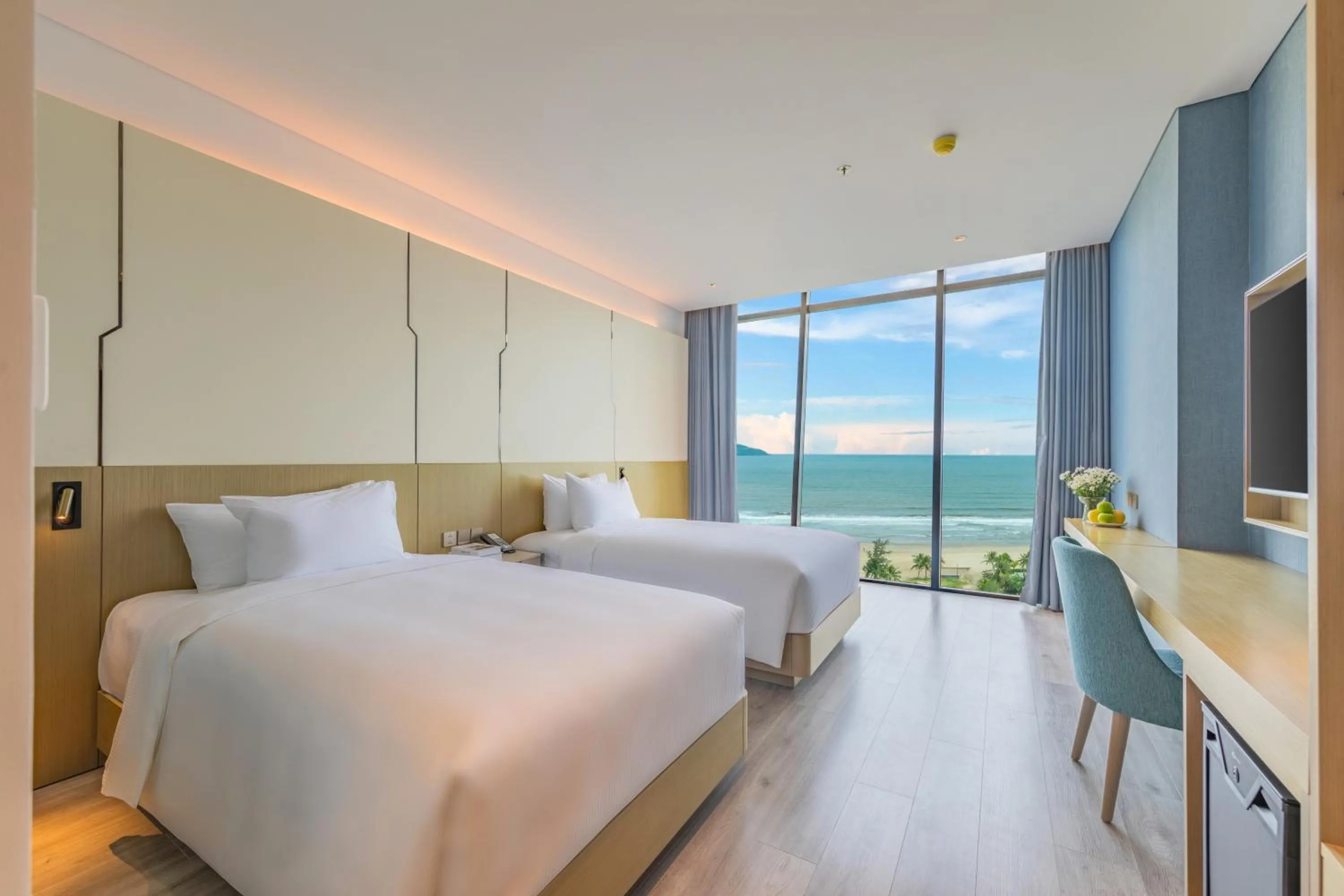 Bed in Awaken Da Nang Hotel