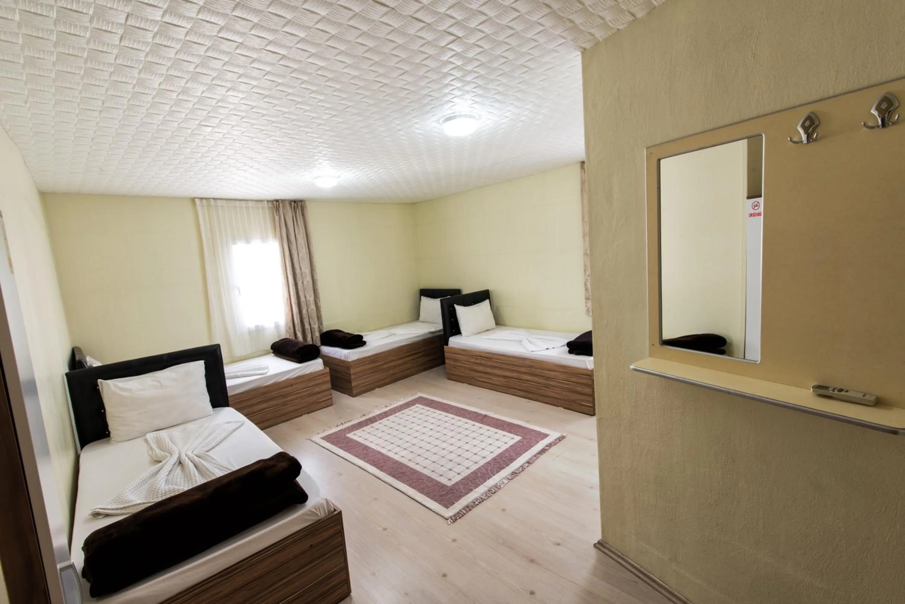 Bed in Yellow Rose Pansiyon