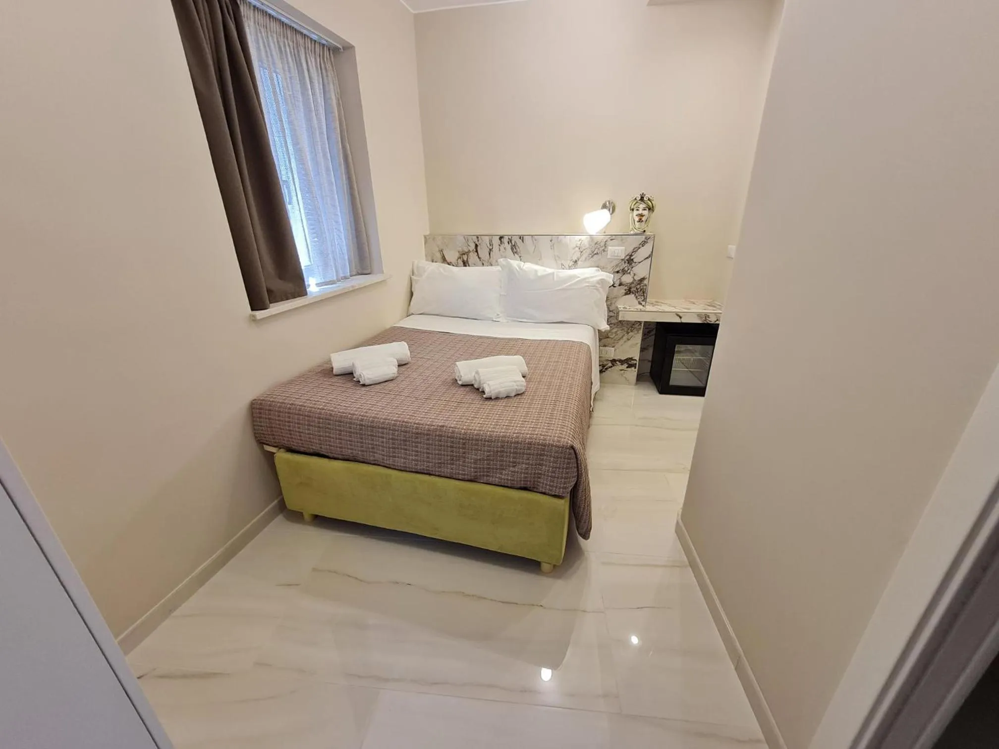 Bed in EPONIMI ROOMs