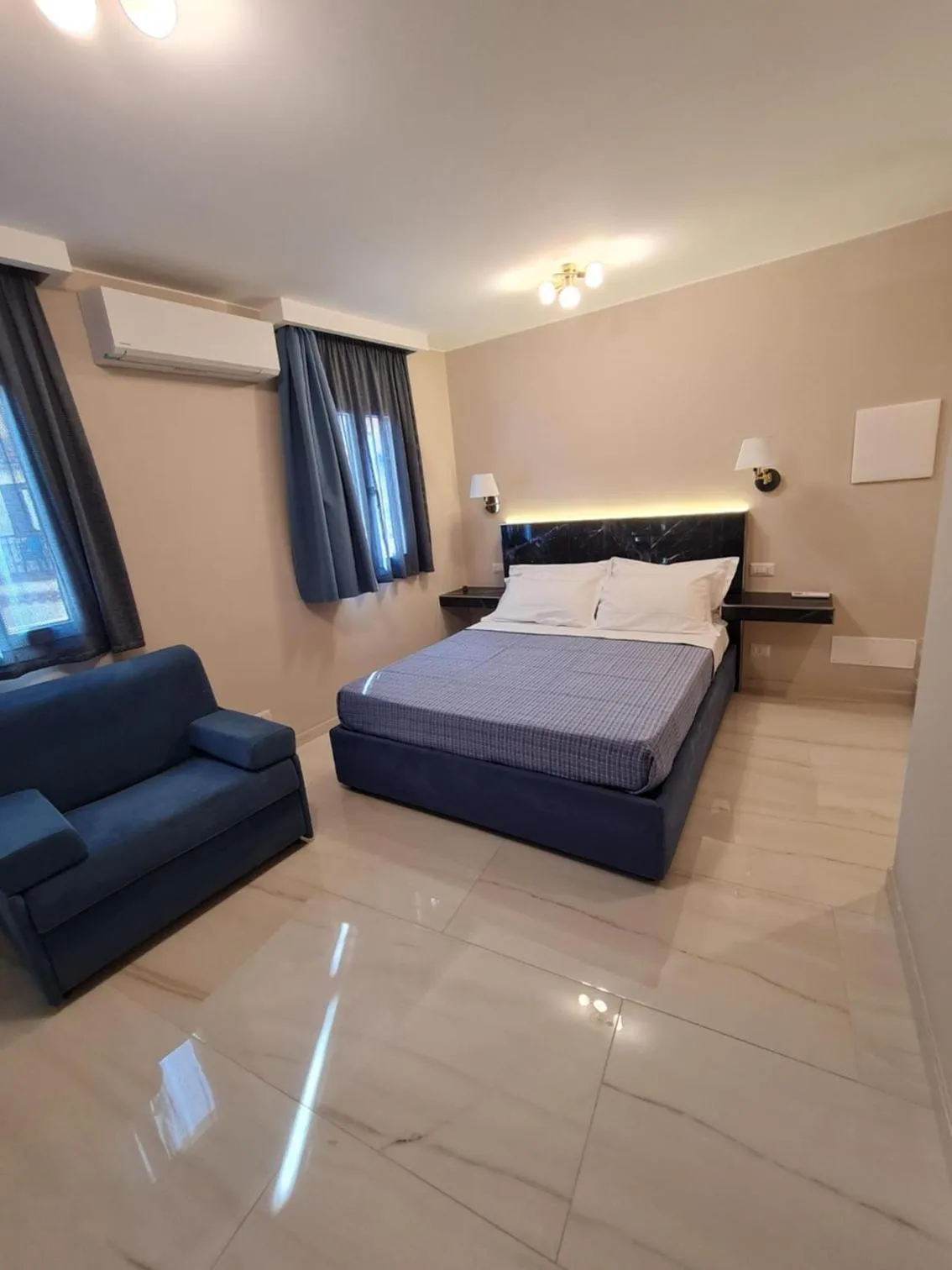 Bed in EPONIMI ROOMs