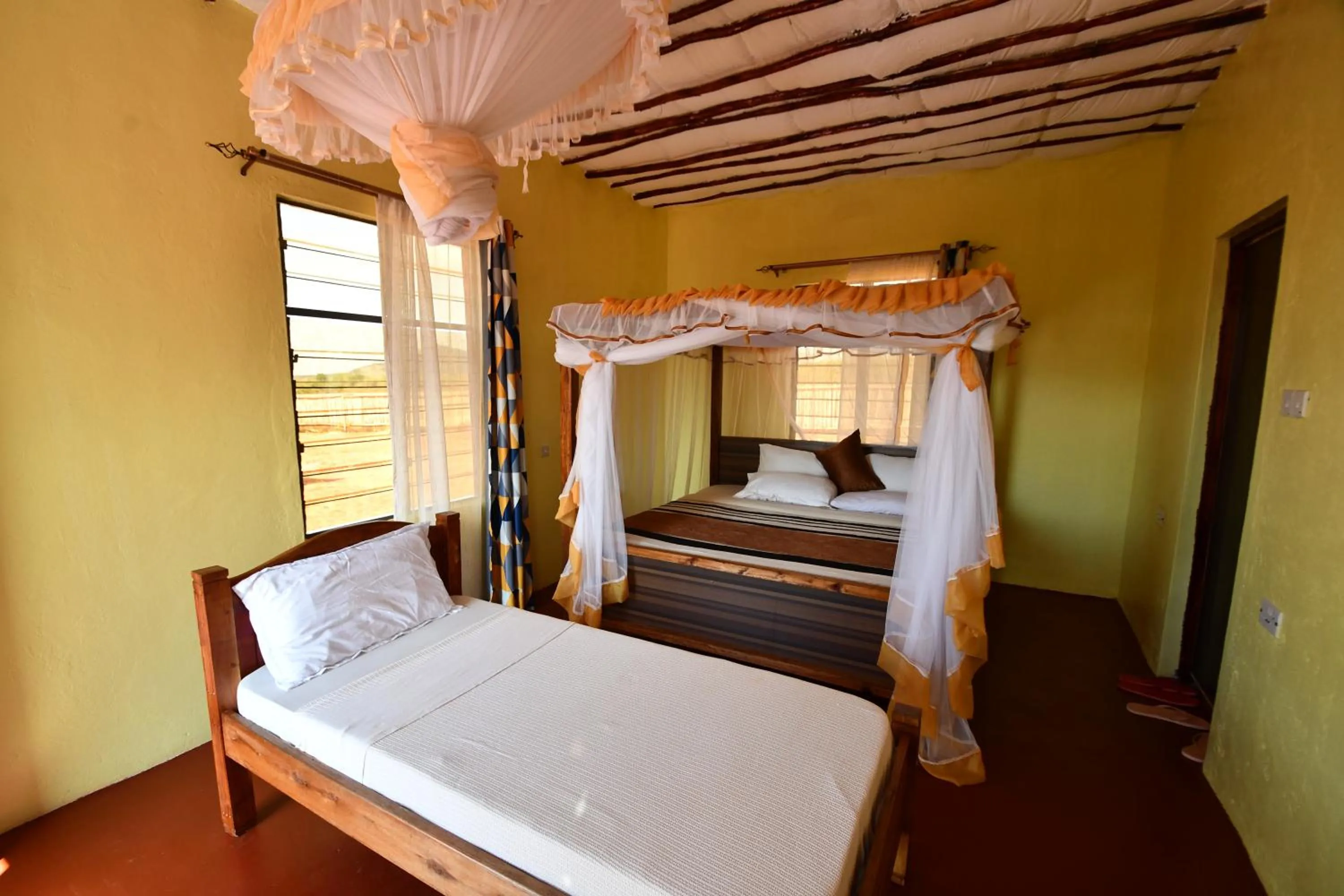 Bed in Tausa Tsavo Eco Lodge