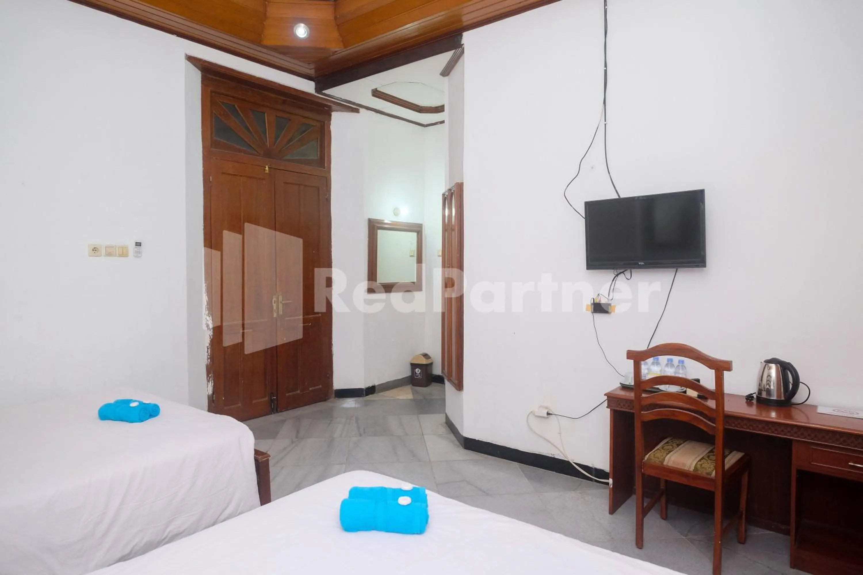 Bed in Hotel Limaran 1 Syariah Malioboro Mitra RedDoorz