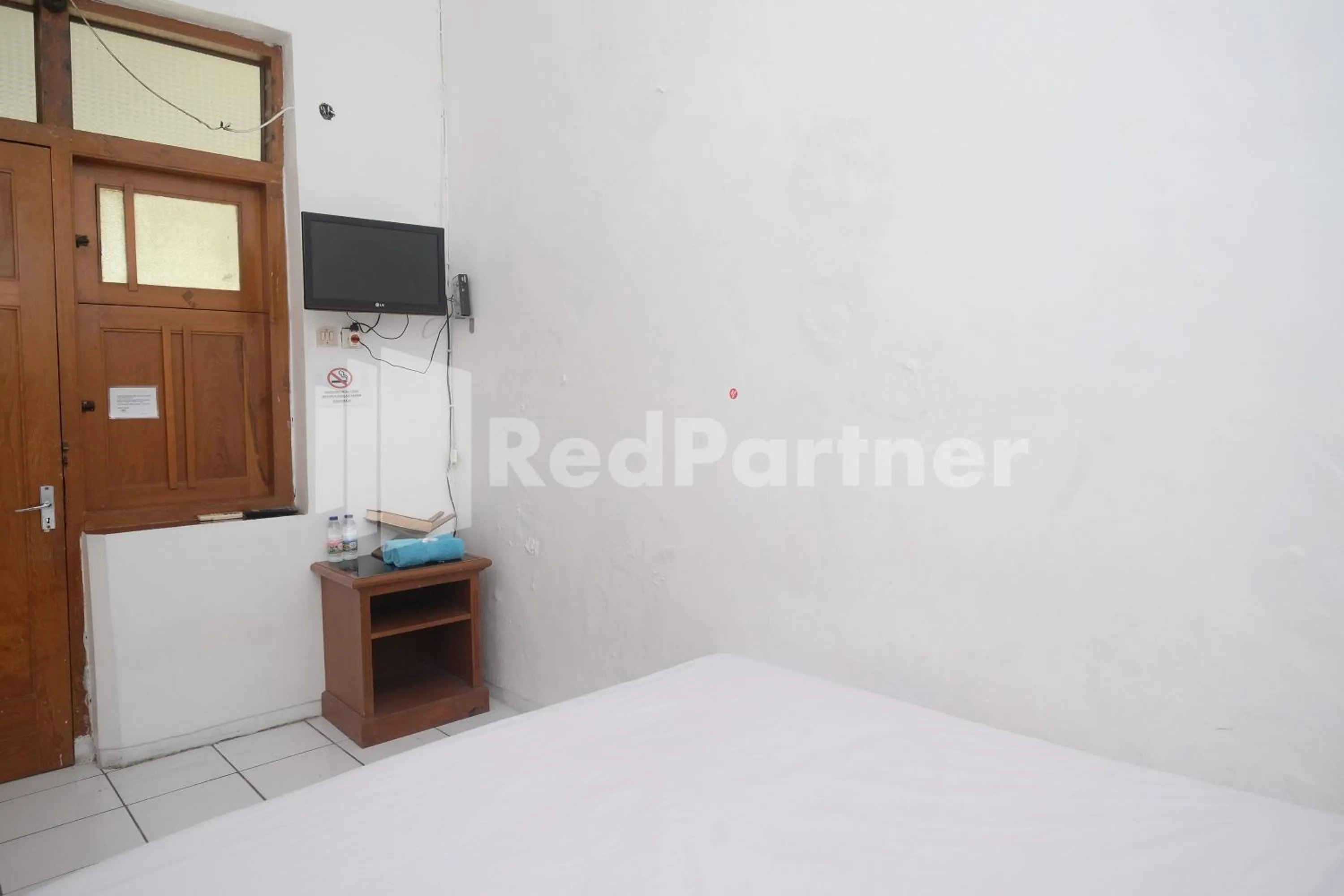 Bed in Hotel Limaran 1 Syariah Malioboro Mitra RedDoorz