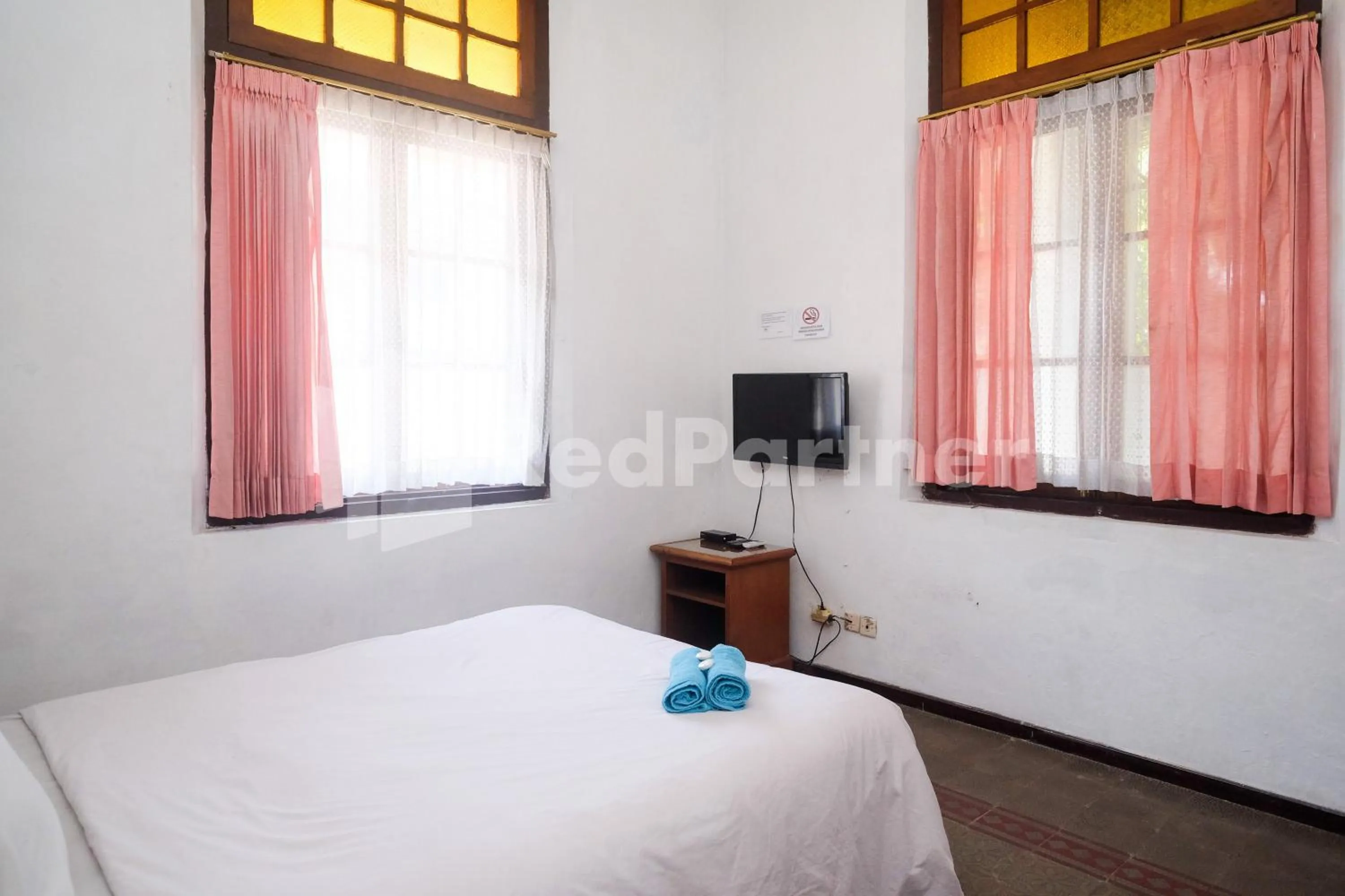 Bed in Hotel Limaran 1 Syariah Malioboro Mitra RedDoorz