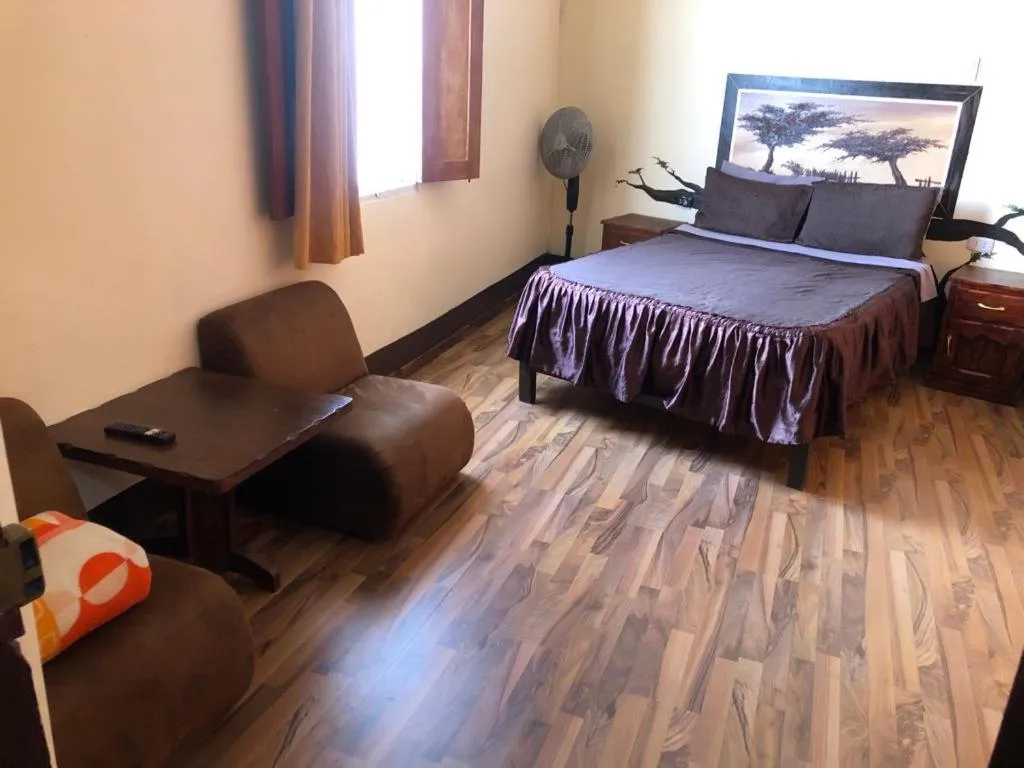 Bed in Hostal Huacachina Sunset