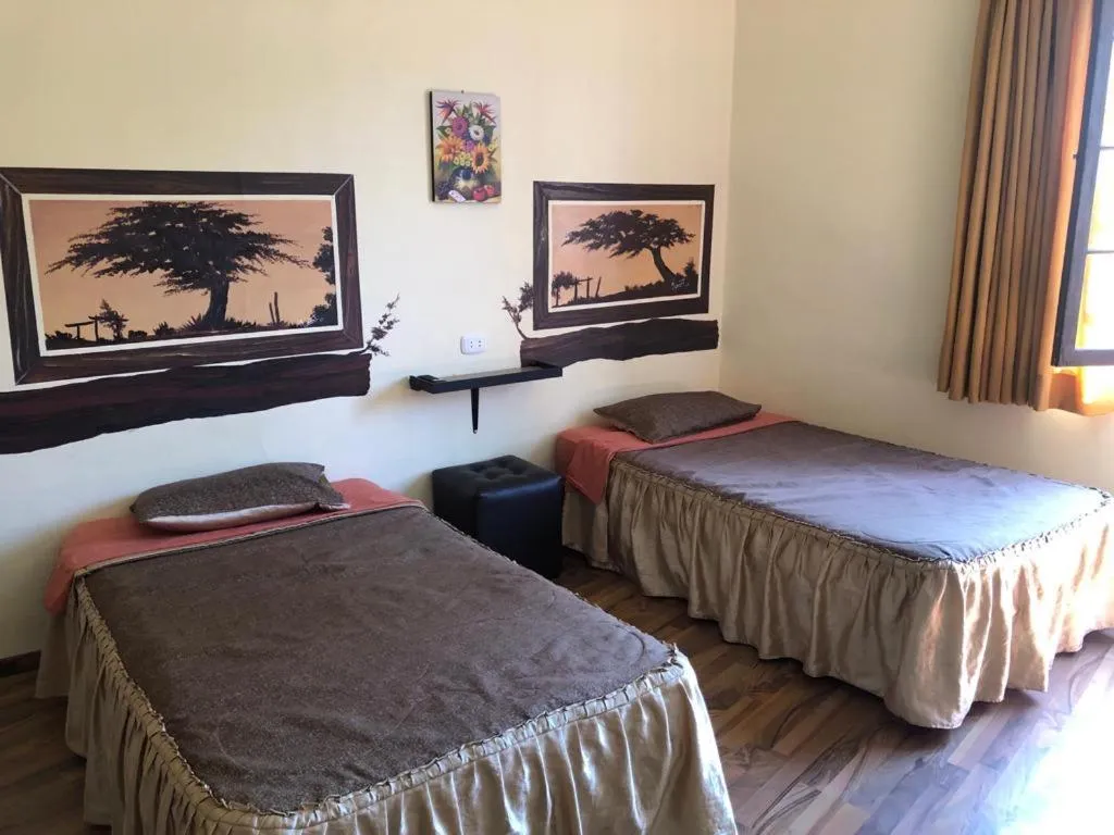 Bed in Hostal Huacachina Sunset