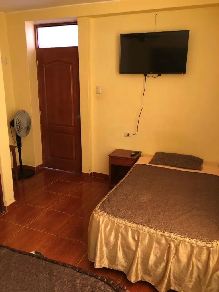 Bed in Hostal Huacachina Sunset