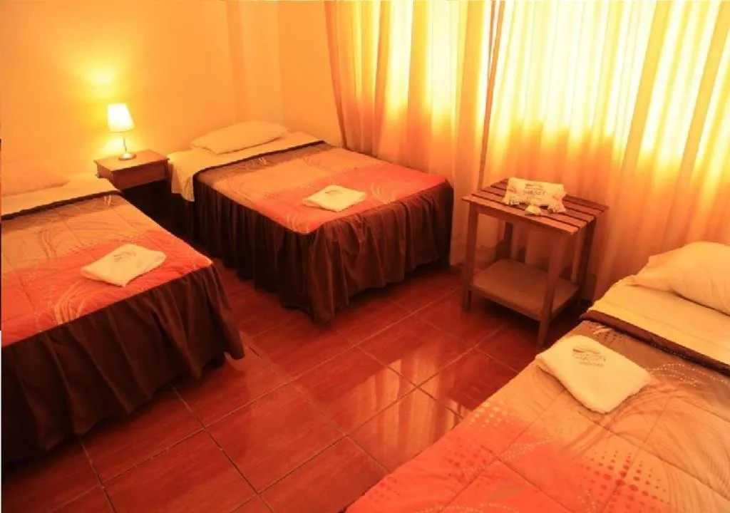 Photo of the whole room, Bed in Hostal Huacachina Sunset