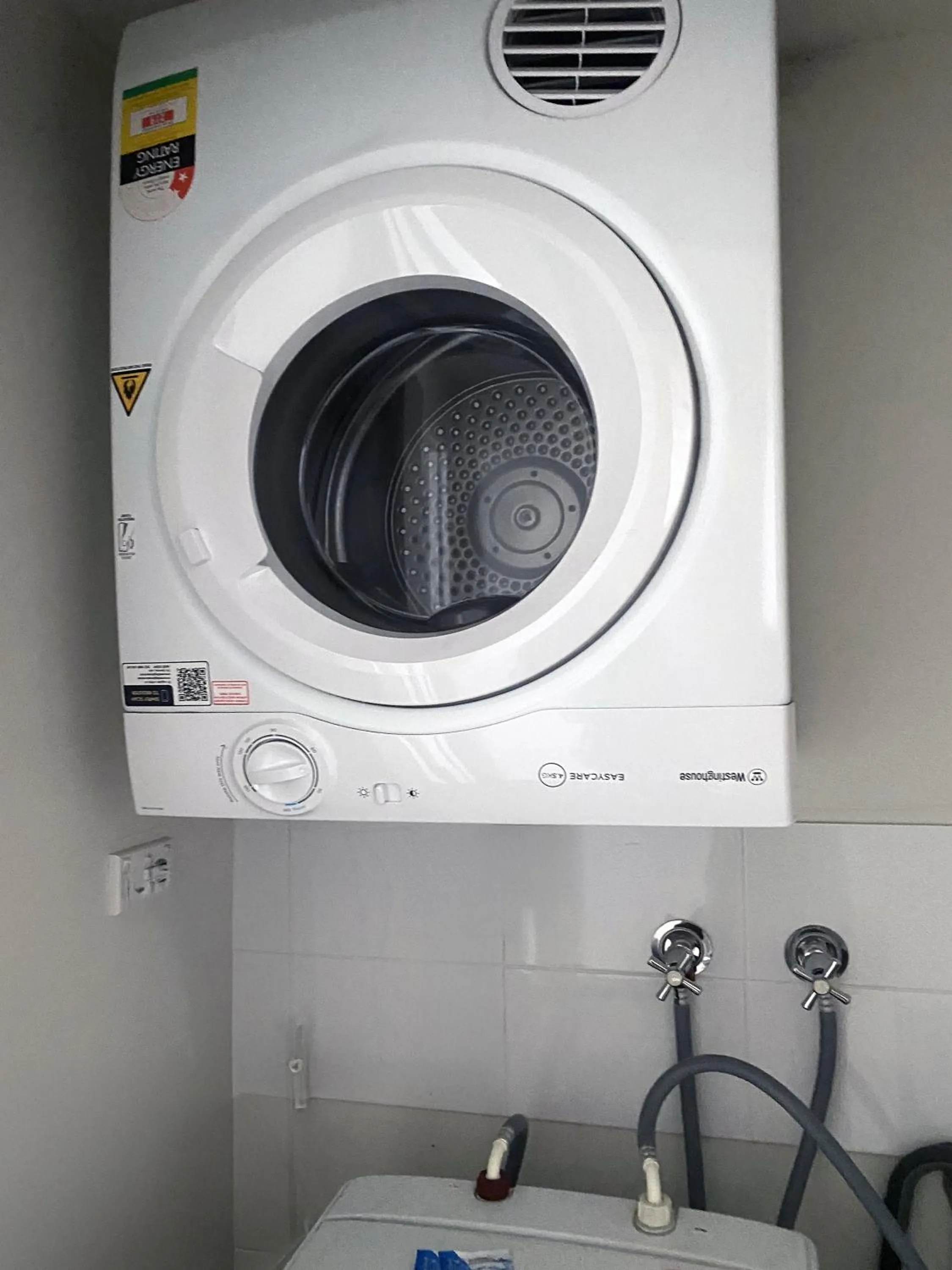 washing machine in Curtis Central Apartments Official