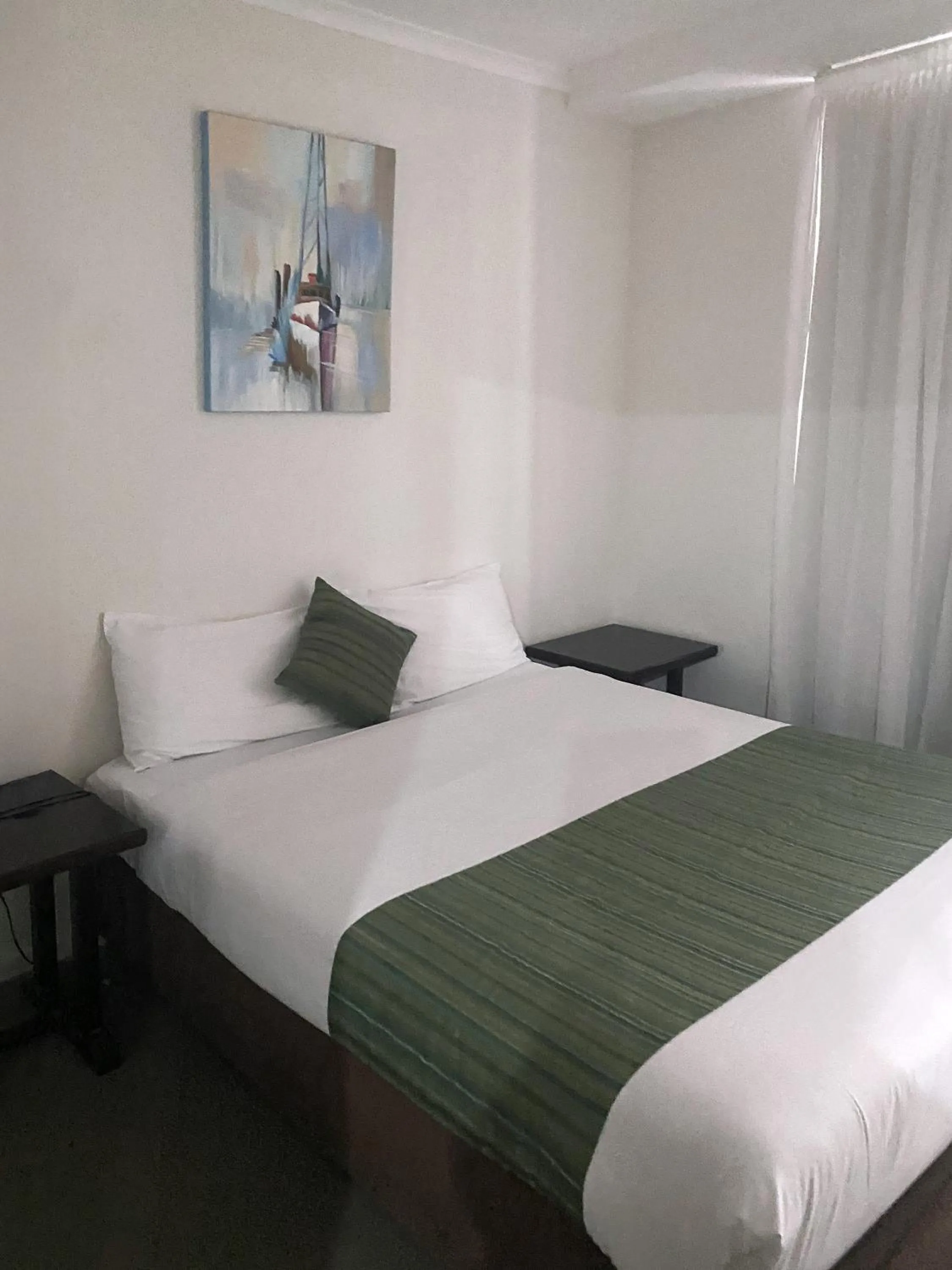 Bed in Curtis Central Apartments Official