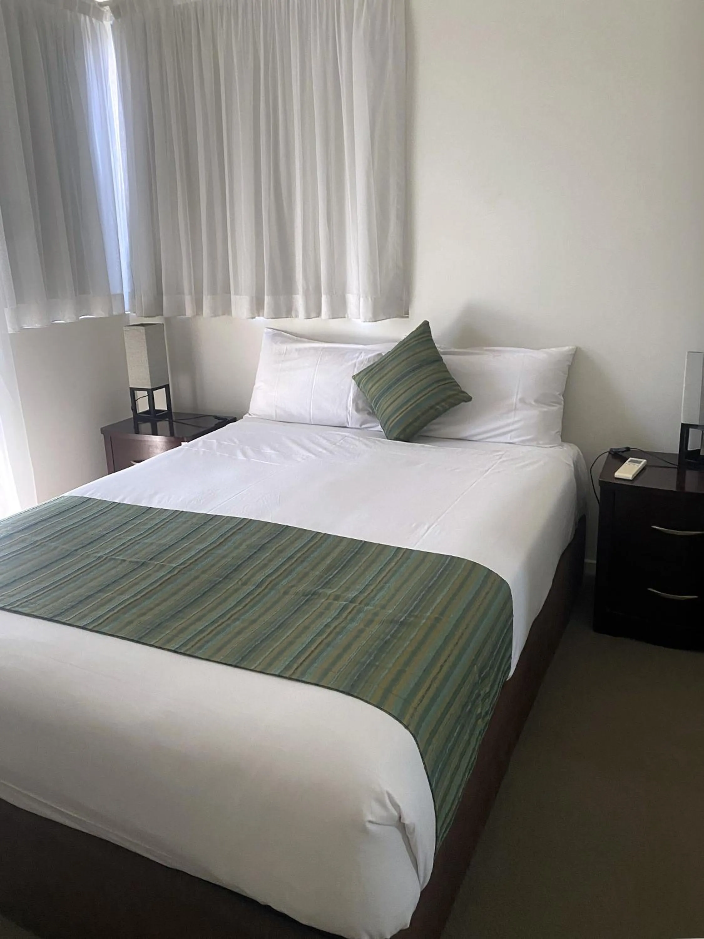 Bedroom, Bed in Curtis Central Apartments Official