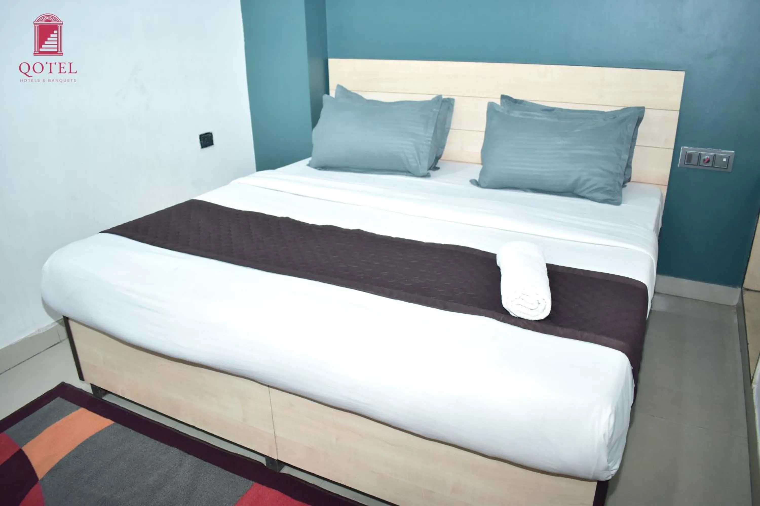 Bed in Qotel Hotel Rama Rohini Sector-24 Couple Friendly