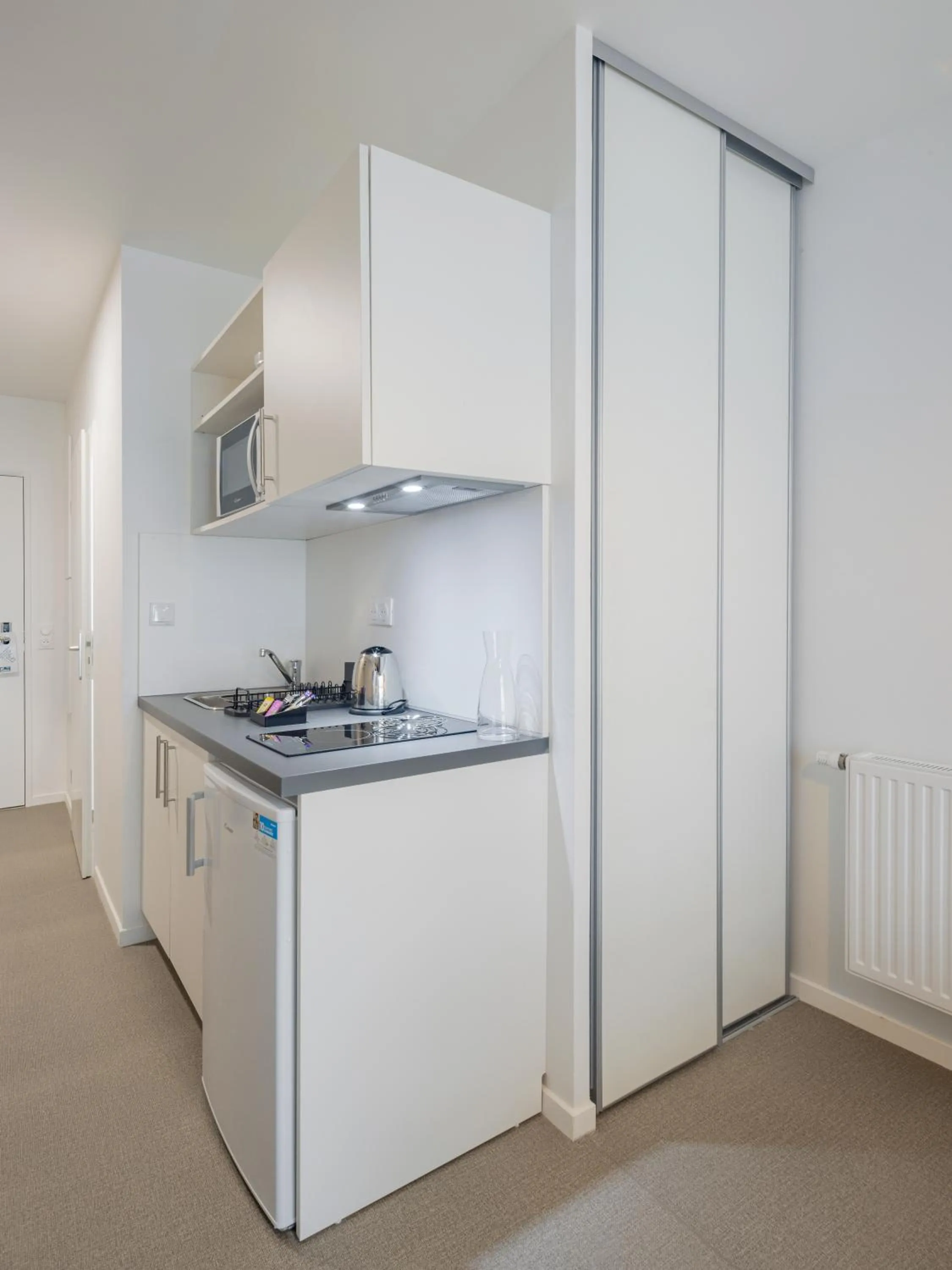 Kitchen or kitchenette in All Suites Appart Hôtel - Le Havre Centre - Les docks