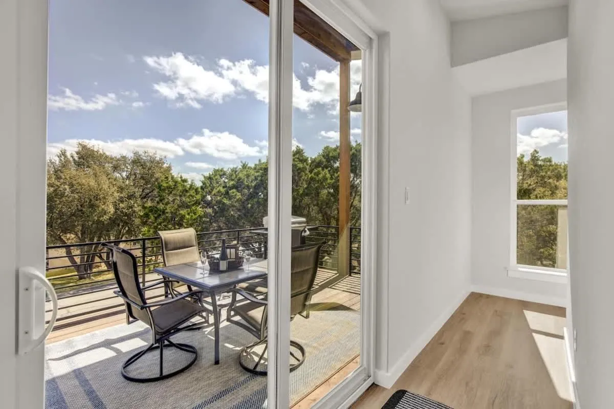 Patio in Stunning Lake Home with Pool-Beach-Gym-Boat Access