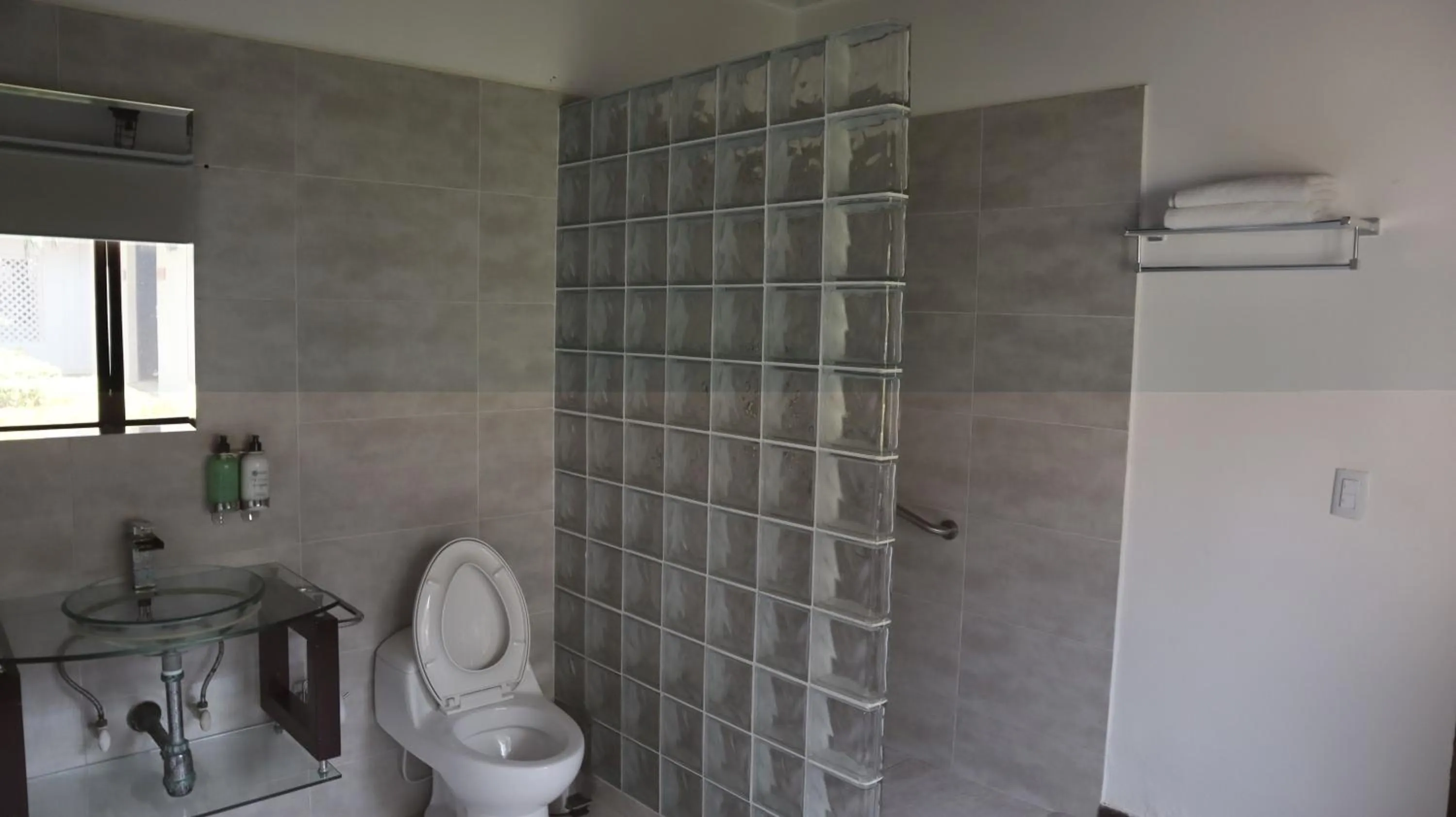 Shower in Hotel Rosario de Mar by Tequendama