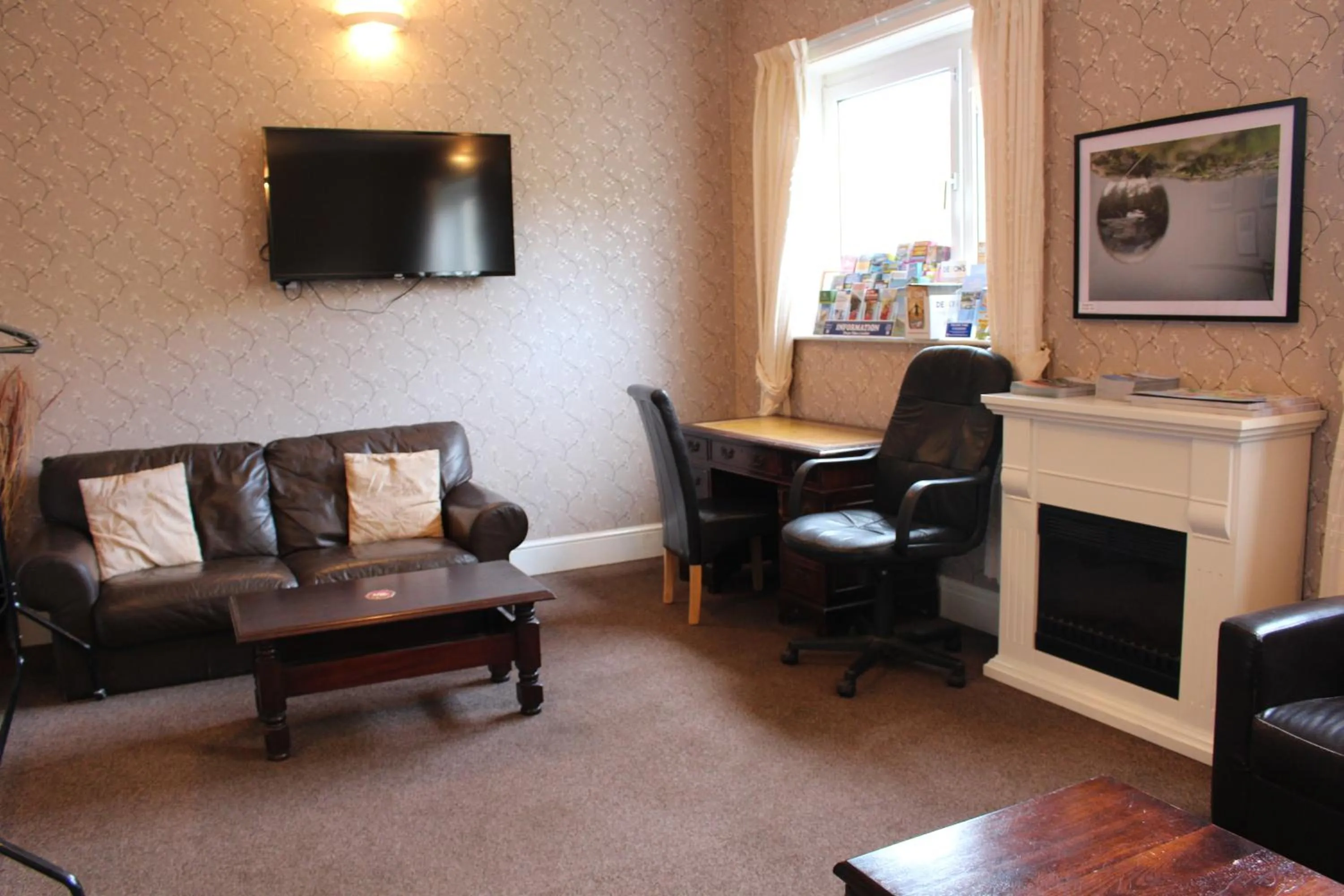 Communal lounge/ TV room in The Moorland Hotel