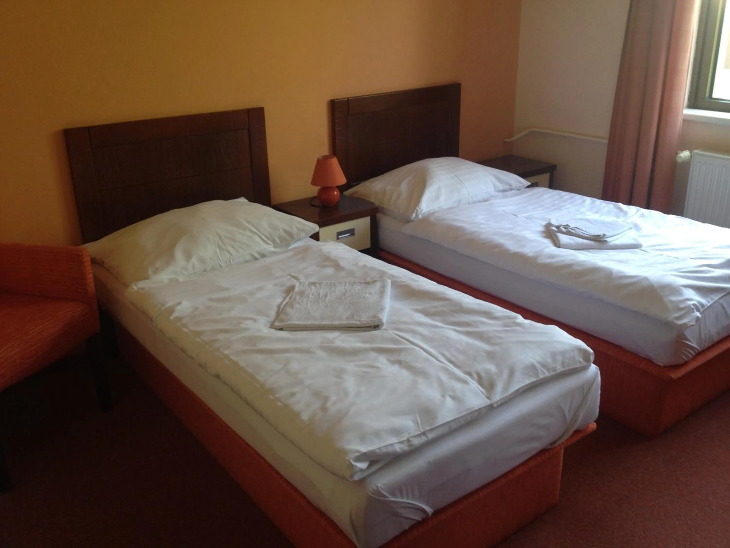 Photo of the whole room, Bed in Garni Hotel Cosmopolitan