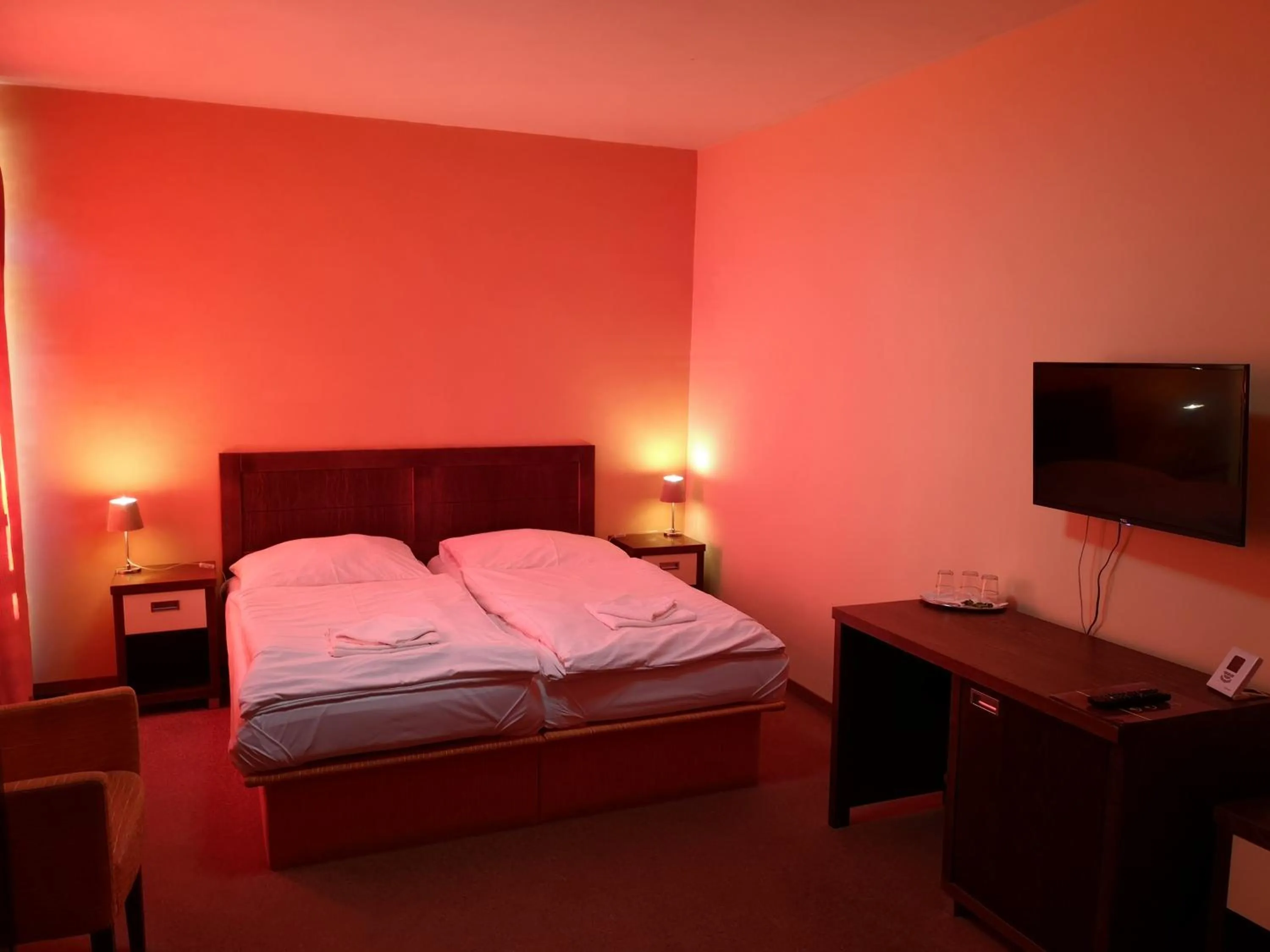 Bed in Garni Hotel Cosmopolitan