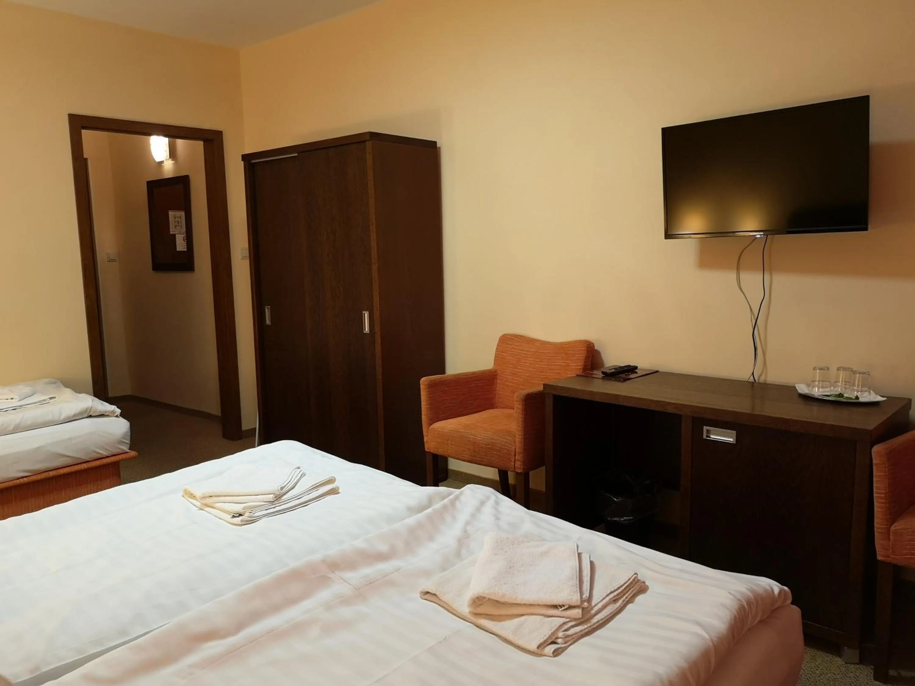 Bed in Garni Hotel Cosmopolitan