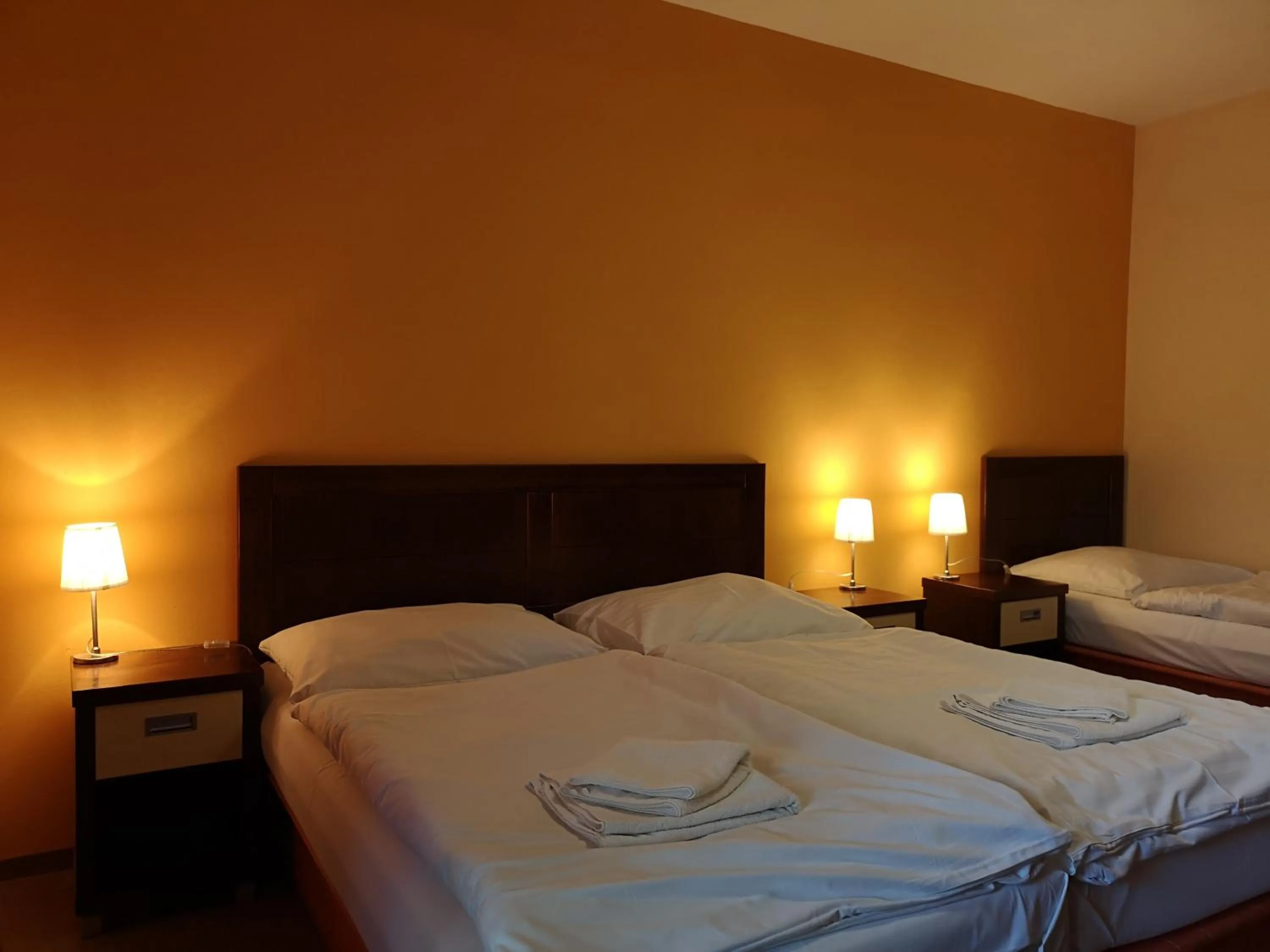 Bed in Garni Hotel Cosmopolitan