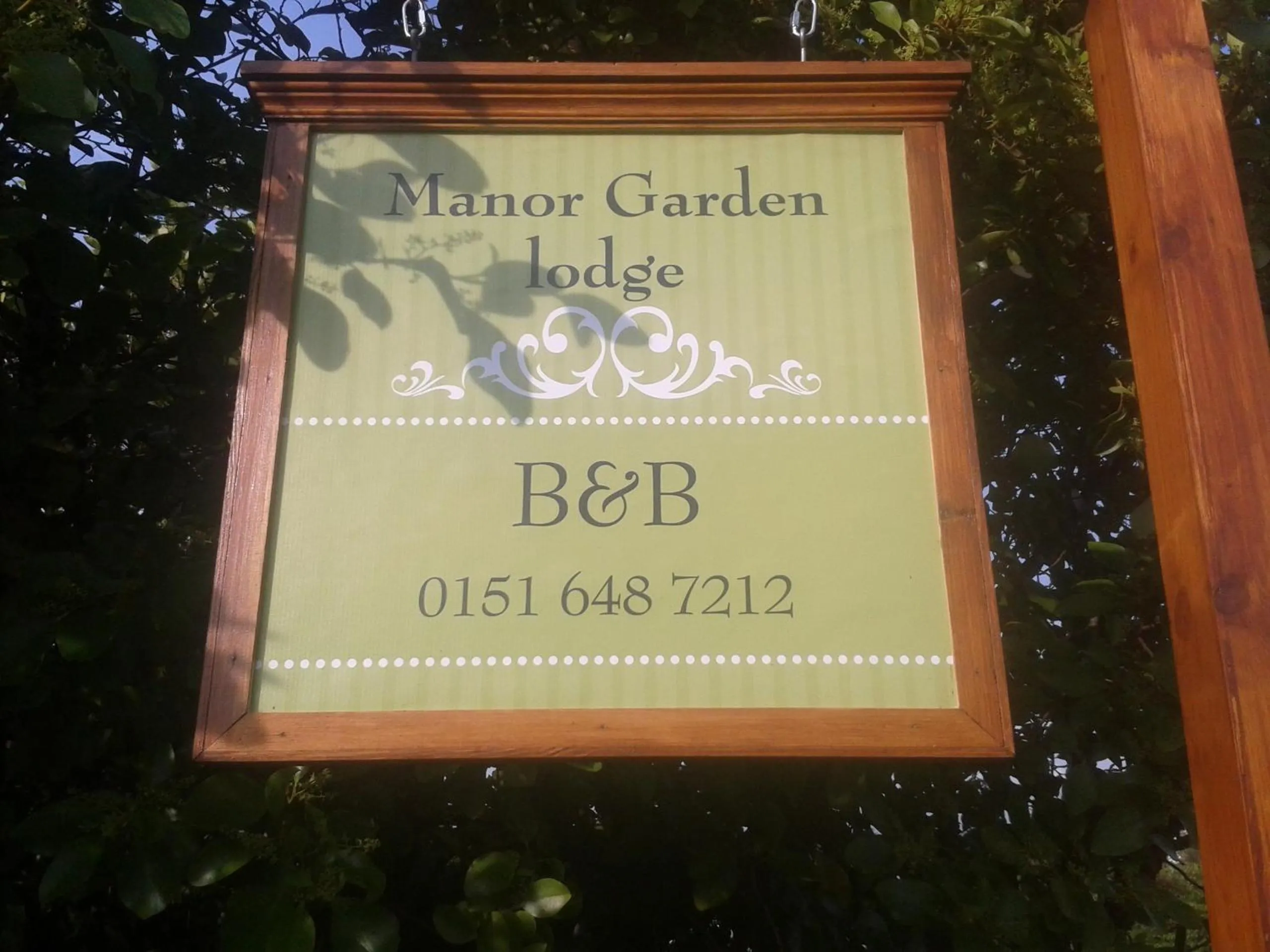 Property logo or sign in Manor Garden Lodge