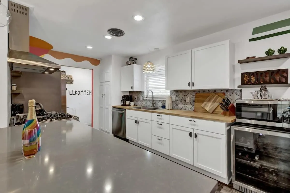 Kitchen or kitchenette in Eclectic Fun Haus with Hot Tub - 3 Min Drive to Main