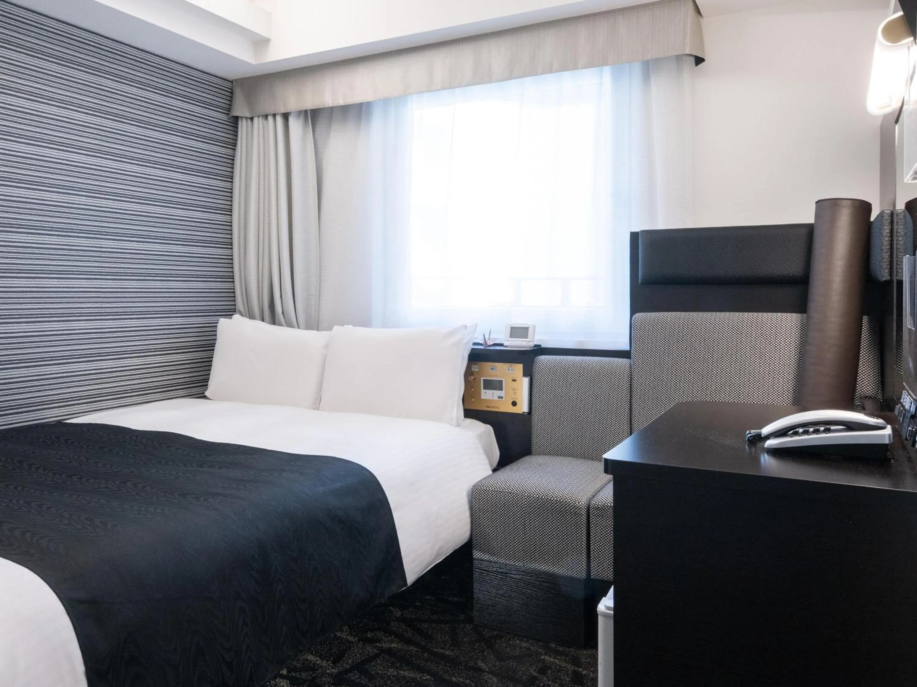 Photo of the whole room, Bed in APA Hotel Hatchobori Ekimae