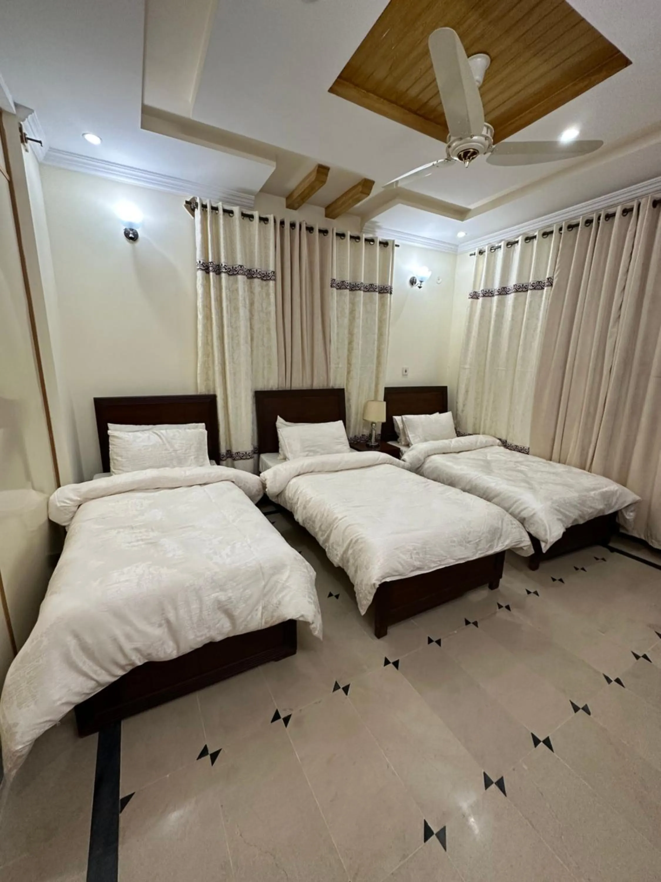 Bed in Roomi Guest House