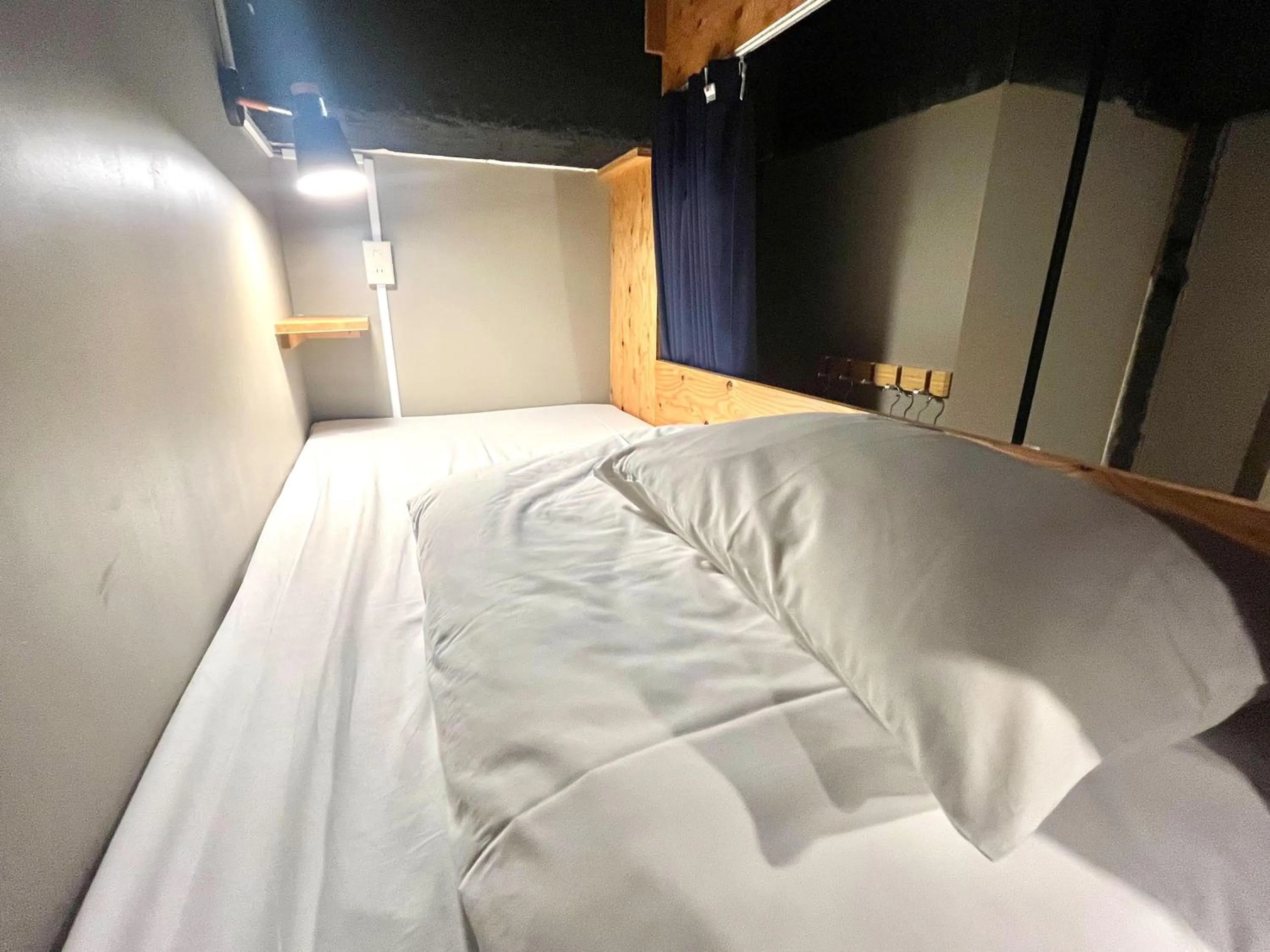 Bed in Wasabi Mita Hotel