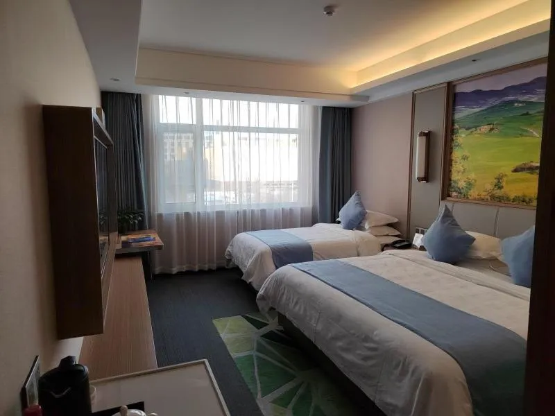 Bed in GreenTree Eastern Hotel Hainan Free Trade Port Jiangdong New District Meilan Airport