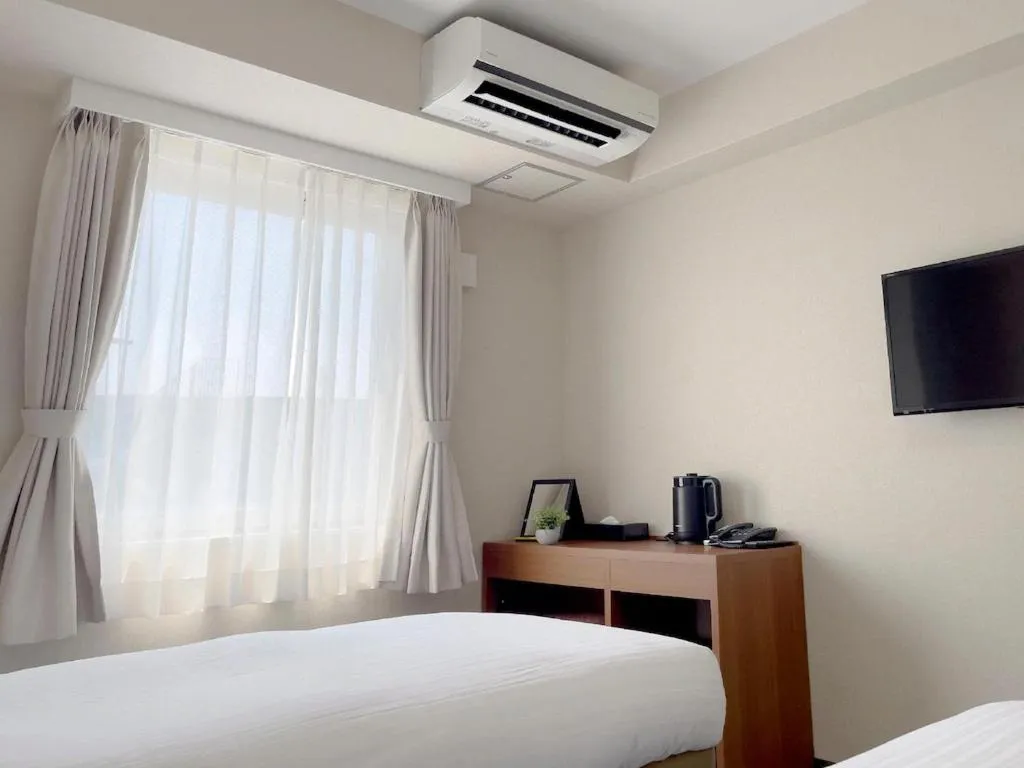 Bed in CHECKinn Osaka Shinimamiya