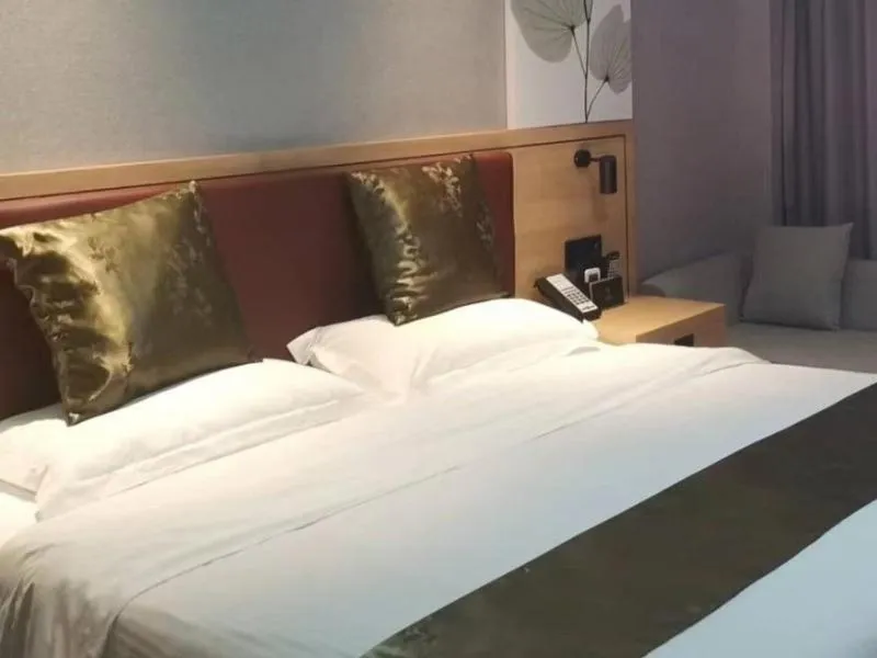 Bed in GreenTree Inn Express Changzhou Caoqiao Industrial Park