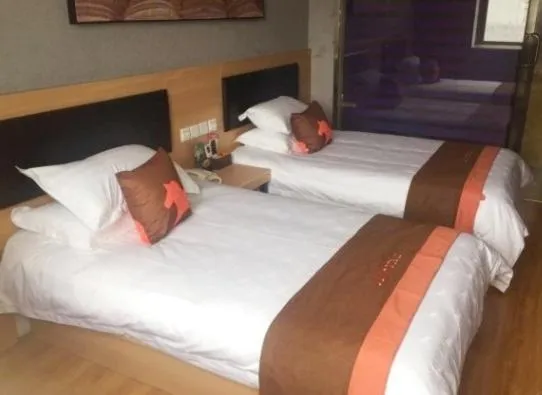Bed in Junyi Hotel Jinhua Wuyi Hot Spring Bus Terminal Station