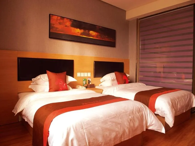 Bed in Junyi Hotel Jinhua Wuyi Hot Spring Bus Terminal Station